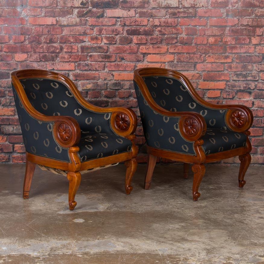 This handsome pair of antique Danish club chairs set the tone in smoking rooms and exclusive clubs in turn of the century Europe. With Classic style, they still make a strong fashion statement today. These are very comfortable arm chairs with a rich