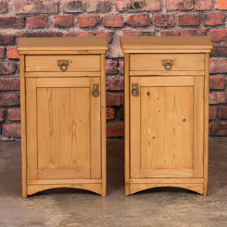 This pair of quaint European nightstands have simple lines enhanced by a waxed finish, bringing out the warmth of the natural pine. The drawer over door configuration makes them easy to place as side tables or nightstands, and add easy function to a