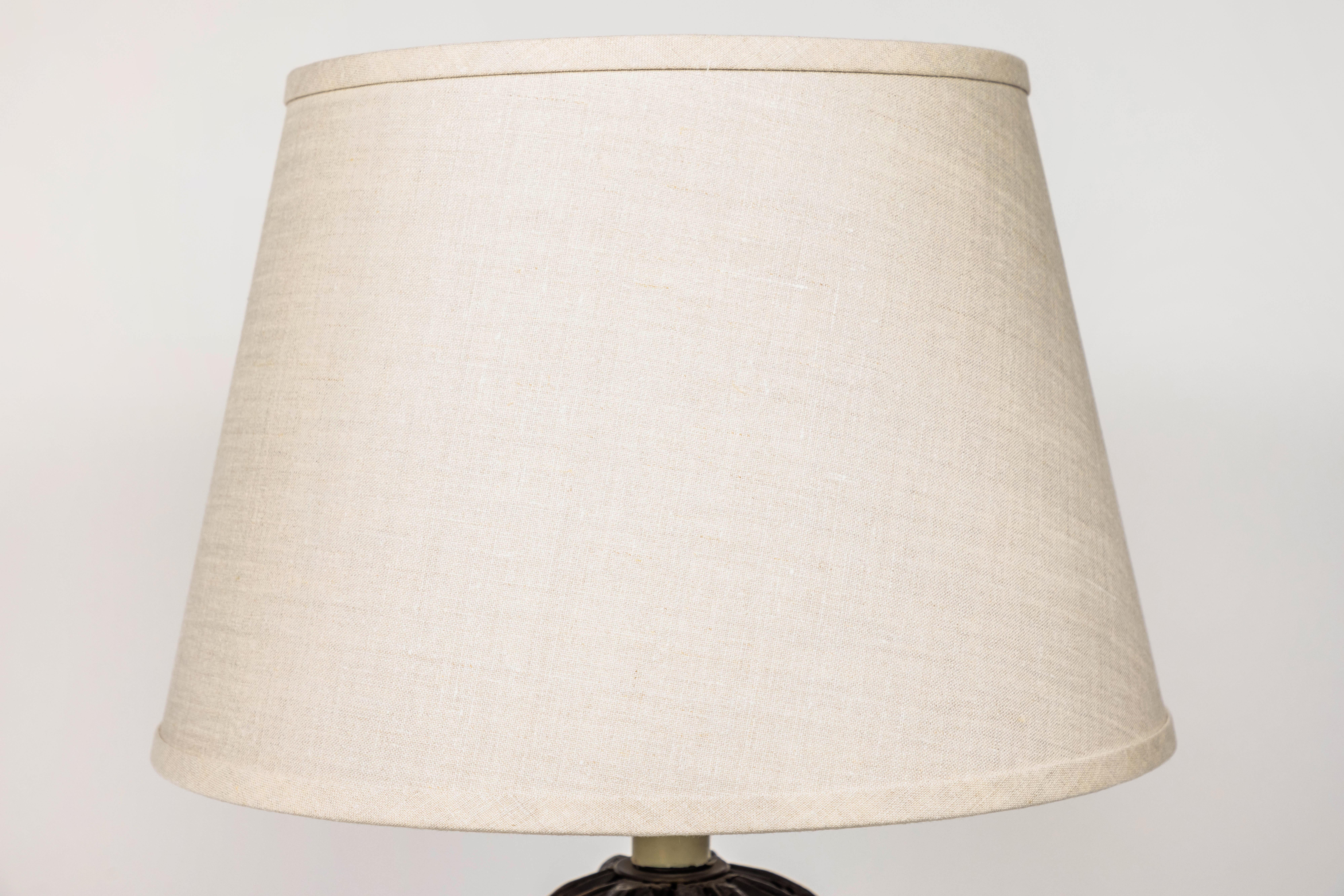 Pair of antique decorative carved wood architectural salvage pieces newly made into table lamps. They have new classic custom linen shades and are newly wired and are ready to adorn your space.
(Possibly Victorian).