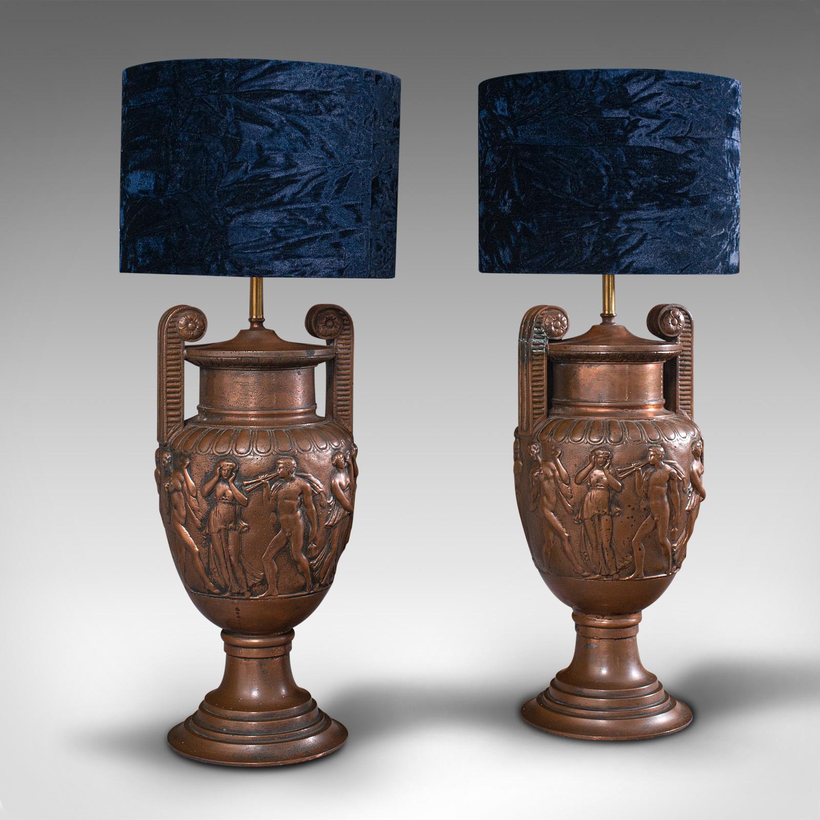 This is a pair of antique decorative lamps. An English, bronze table light with ancient Roman influence from the famous Townley Vase, dating to the late Victorian period, circa 1900.

Superb bronze homage to the Townley Vase, a large Roman vase of
