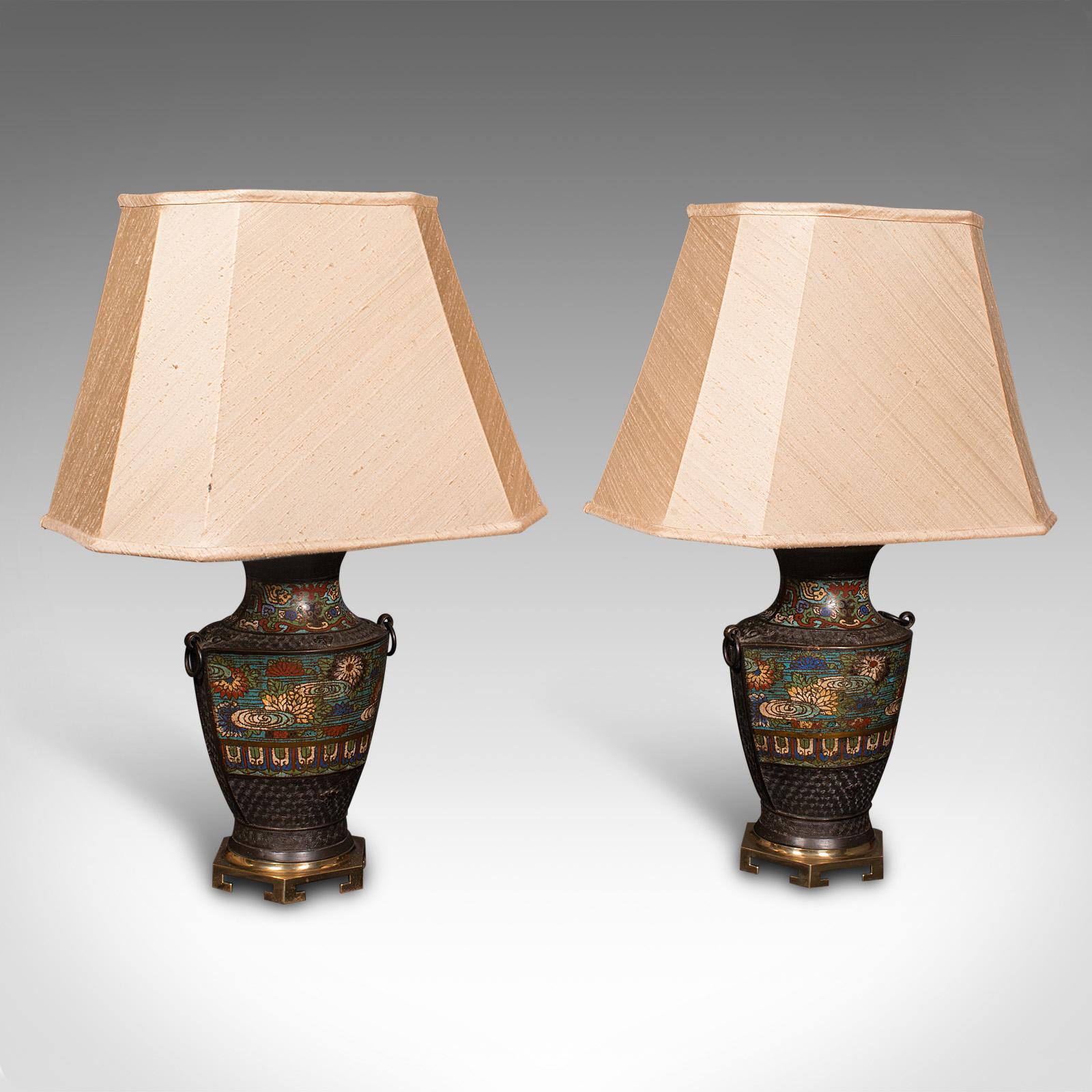 This is a pair of antique decorative lamps. A Japanese, bronze and enamel temple jar light, dating to the late Victorian period, circa 1880.

Charming colour to these substantial decorative lamps
Displaying a desirable aged patina and in good