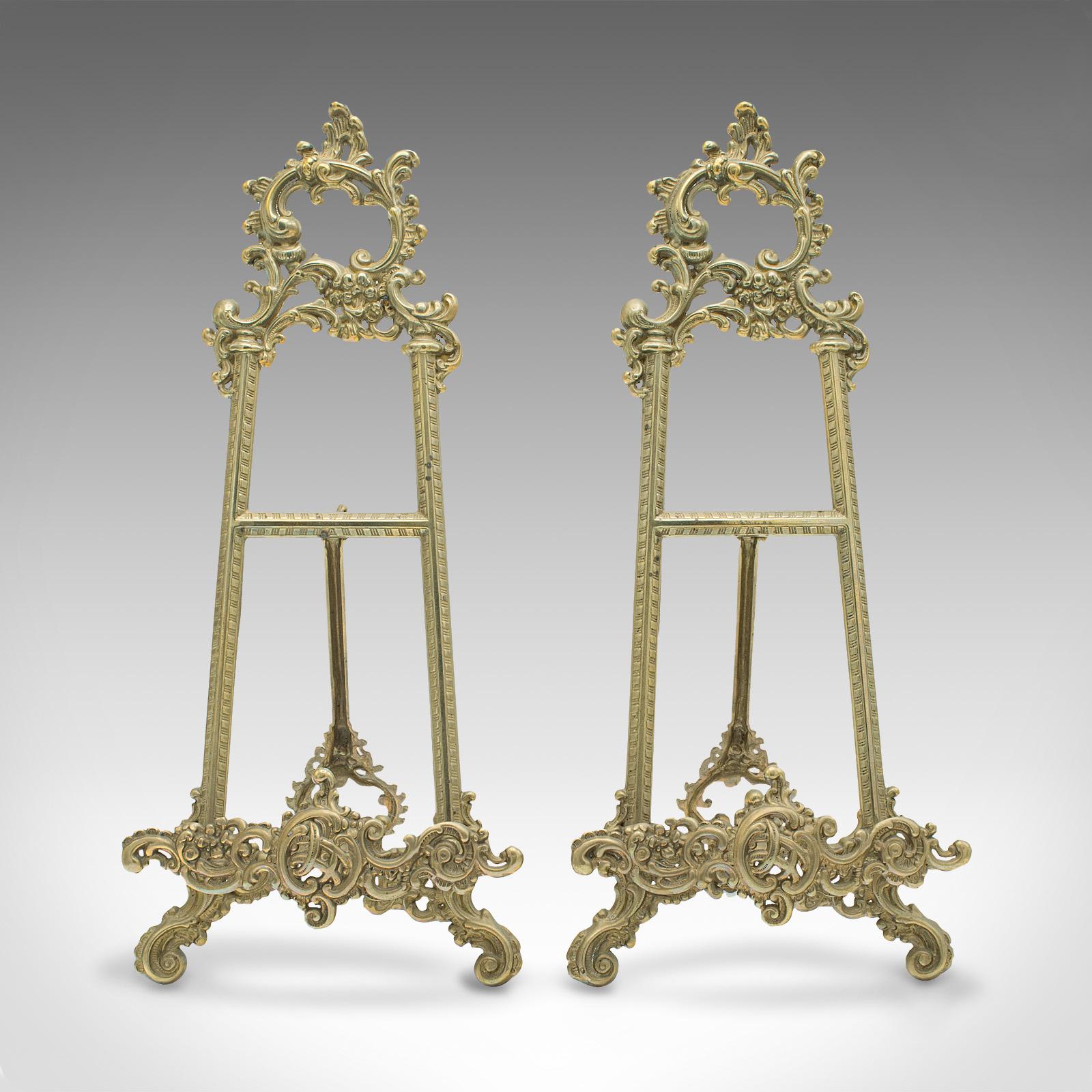 This is a pair of antique decorative picture stands. An English, brass book rest or artist's easel in Art Nouveau taste, dating to the early 20th century, circa 1920.

Versatile and appealing as a pair of stands
Displaying a desirable aged patina