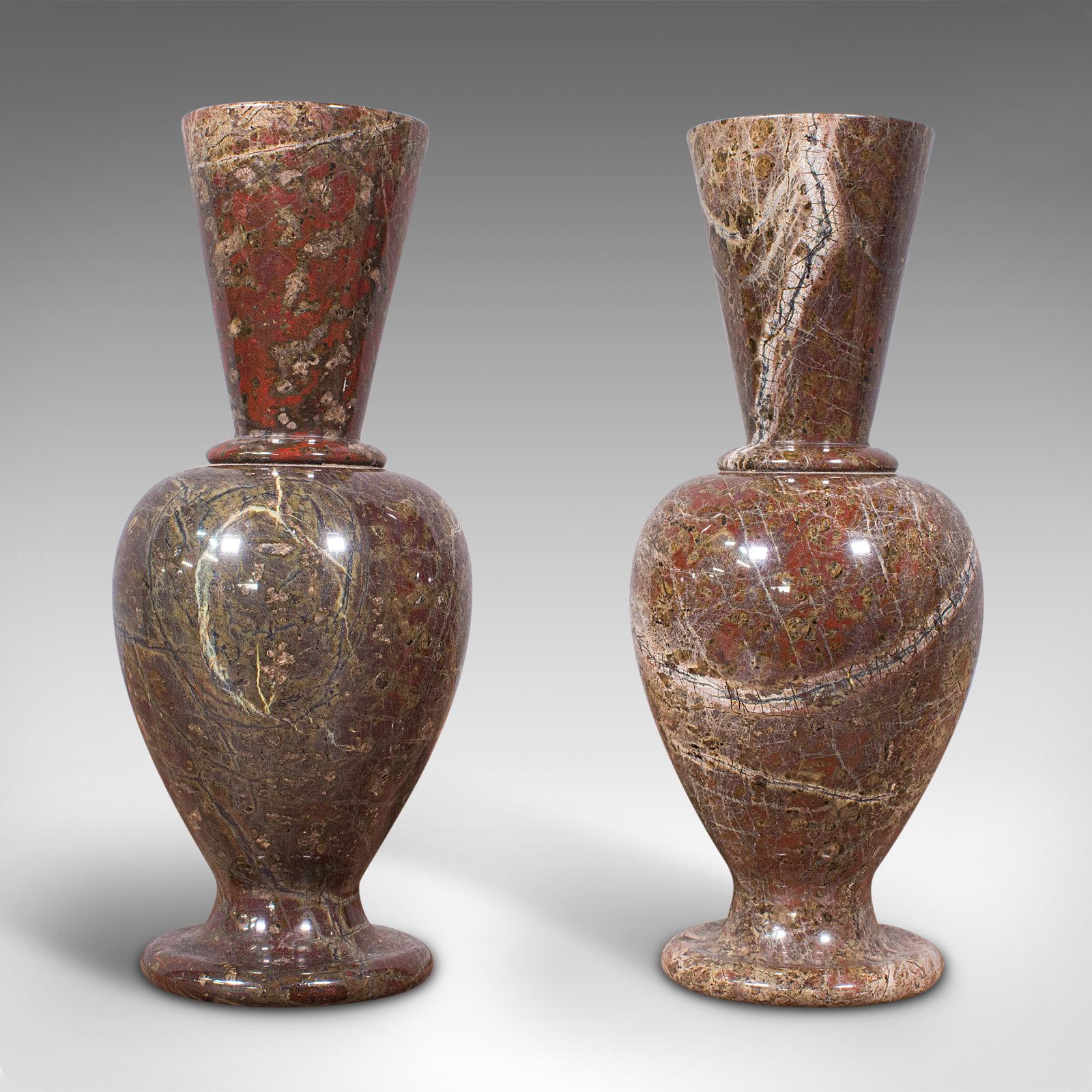 This is a pair of antique decorative posy vases. An English, polished granite flower urn, dating to the late Victorian period, circa 1900.

Striking appearance and beautifully tactile
Displays a desirable aged patina and in good order
Polished