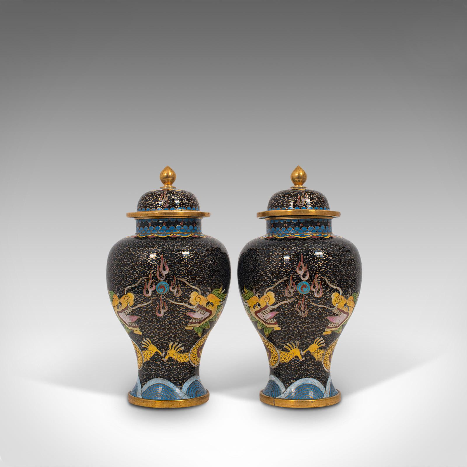 This is a pair of antique decorative spice jars. A Chinese, cloisonné baluster urn, dating to the late Victorian period, circa 1900.

Eye-catching dragons and delightful forms
Displays a desirable aged patina and in super condition
Cloisonné