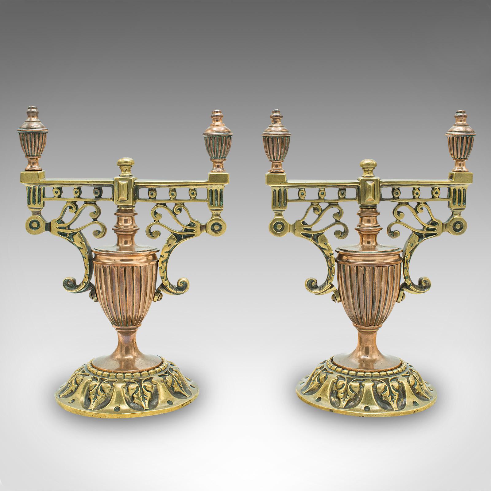 This is a pair of antique decorative tool rests. A Continental, brass and copper fireside stand in the Grand Tour taste, dating to the early Victorian period, circa 1860.

Beautifully ornate and of superb quality, perfect for the grand fireplace