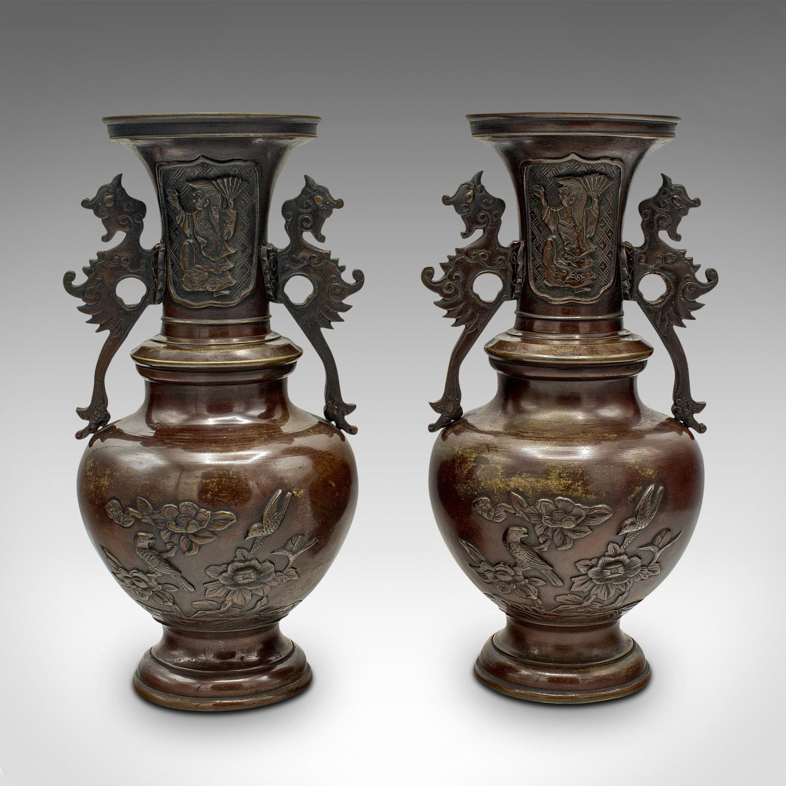 This is a pair of antique decorative urns. A Japanese, bronze baluster vase, dating to the Victorian period, circa 1850.

Delightful pair of vases from the latter years of the Edo period
Displaying a desirable aged patina throughout
Weathered bronze