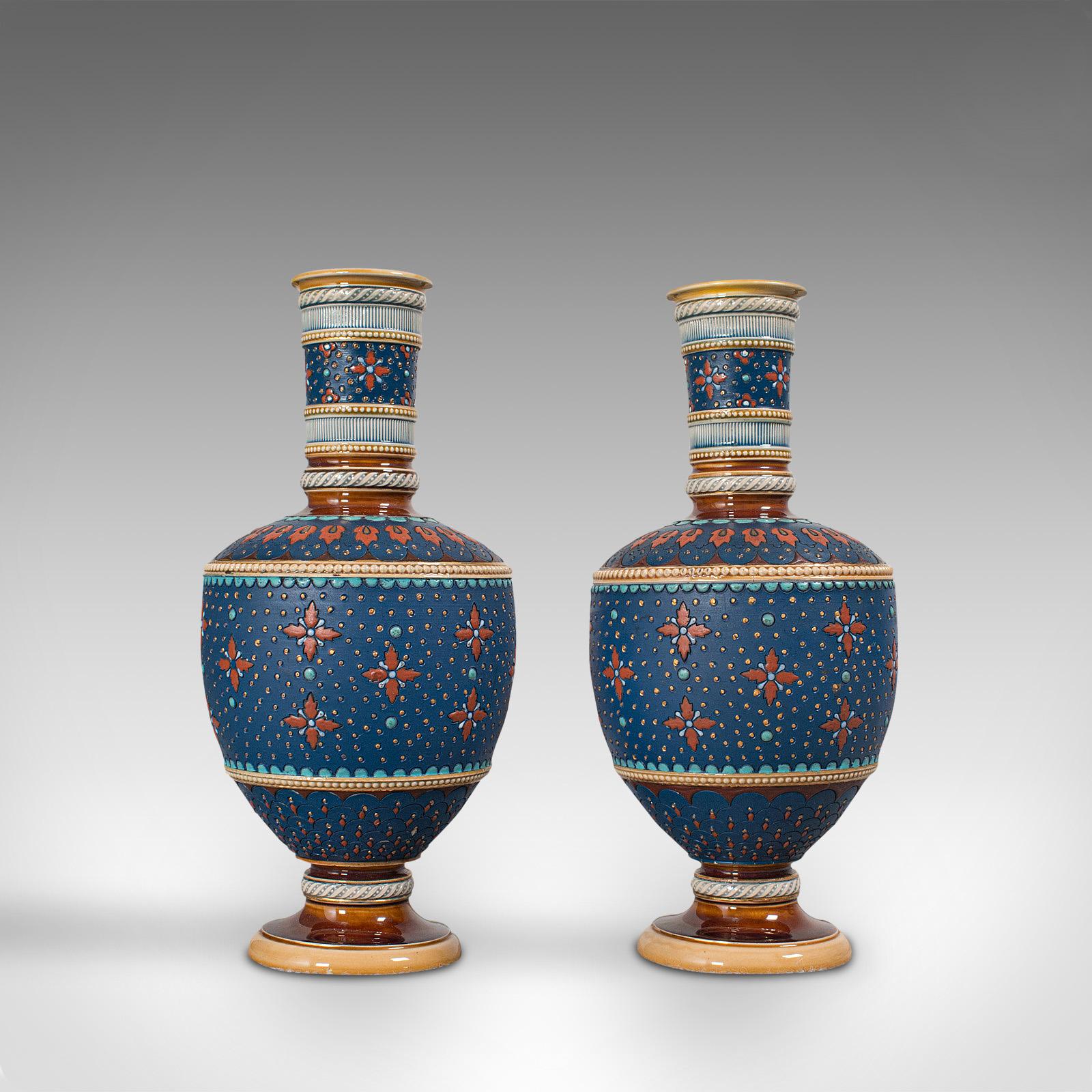 This is a pair of antique decorative vases. A German, ceramic flower vase by Villeroy & Boch of Mettlach, dating to the late Victorian period, circa 1900.

An alluring pair of decorative vases
Displaying a desirable aged patina, in very good