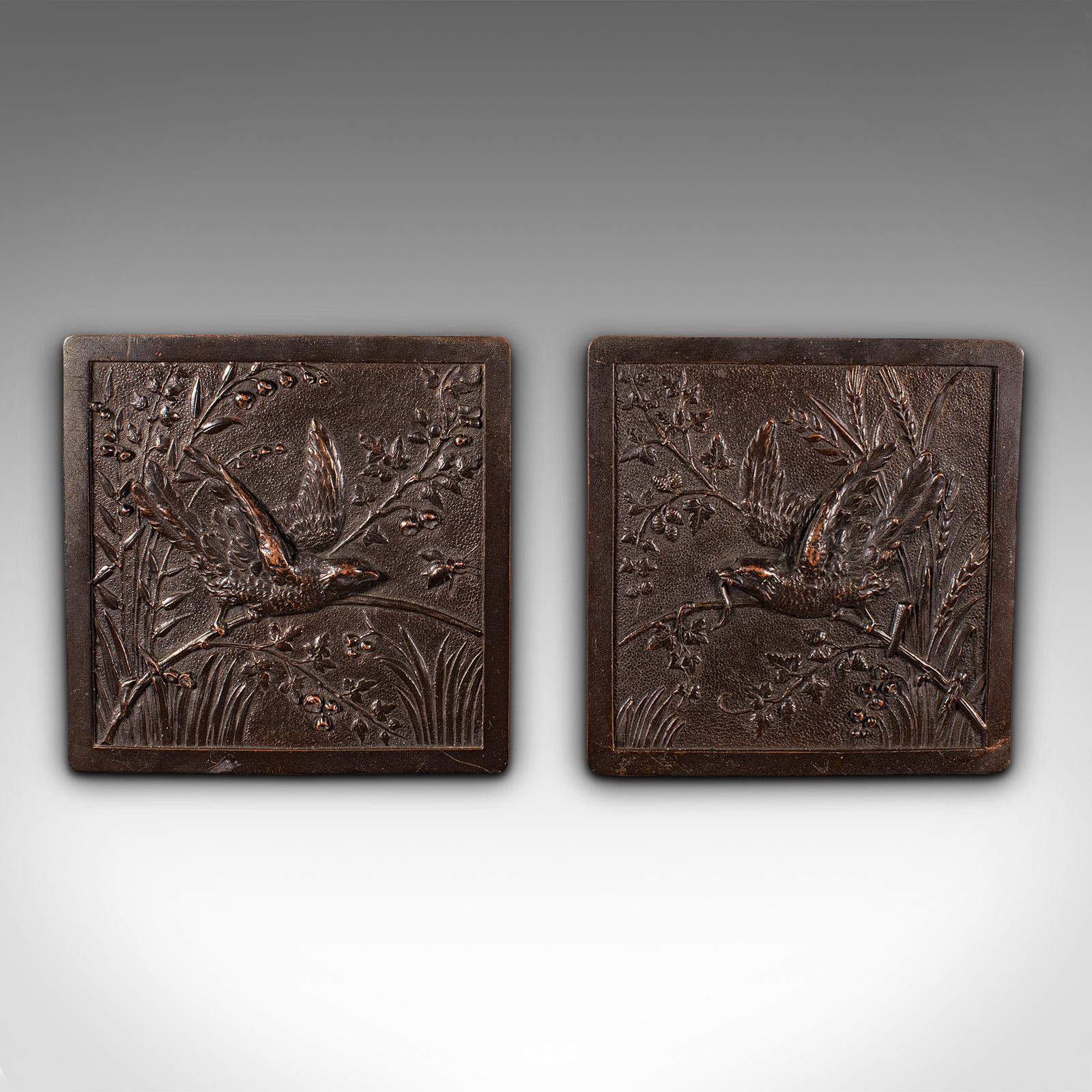 This is a pair of antique decorative plaques. A Japanese, bronze wall panel, dating to the early Victorian period, circa 1850.

Accentuate your wall with a pair of charming Edo period plaques
Displaying a desirable aged patina throughout
Bronze