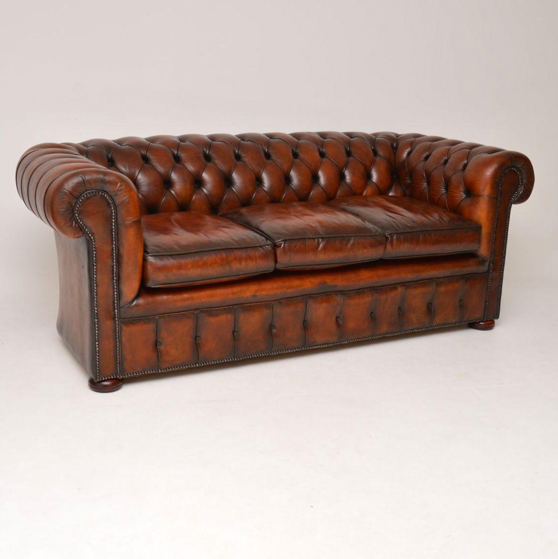 English Pair of Antique Deep Buttoned Leather Chesterfield Sofas