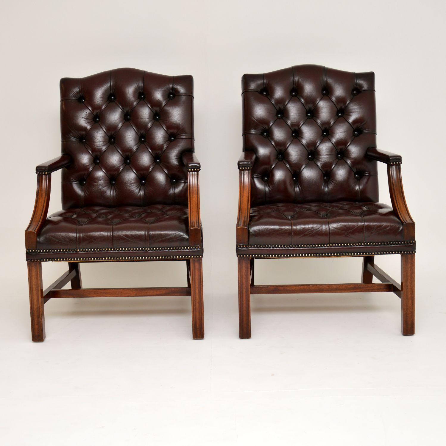 Pair of antique deep buttoned leather & mahogany Gainsborough armchairs in excellent original condition & dating from circa 1950s period.

The seats & backs are deep buttoned & the leather is hand tacked onto the frames. They also have padded