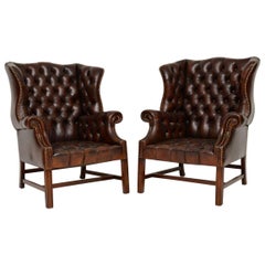 Pair of Antique Deep Buttoned Leather Wing Back Armchairs