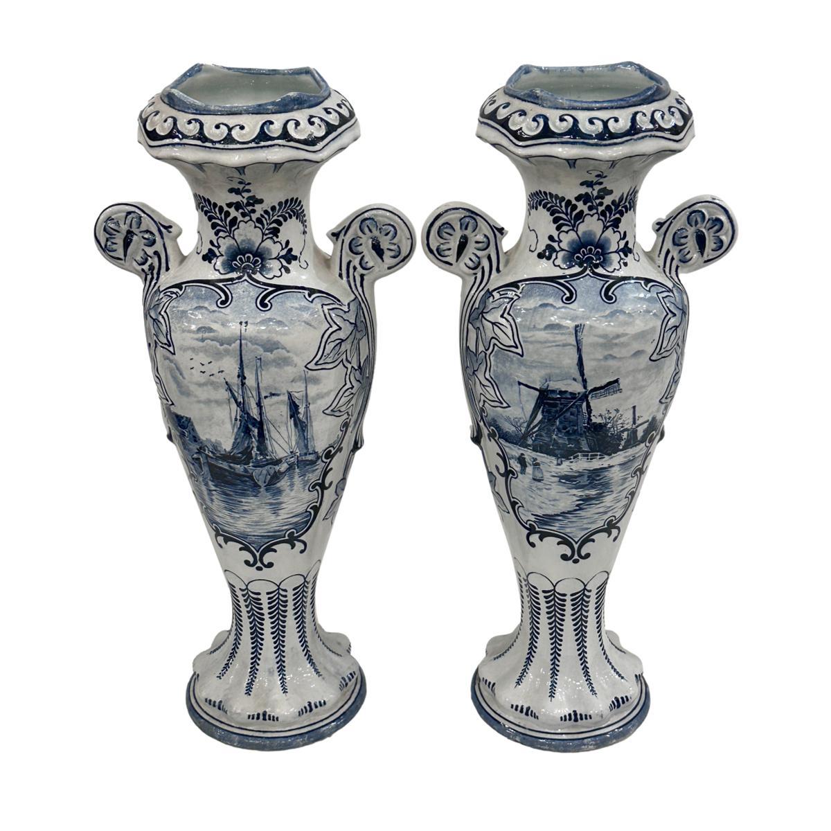Pair of 19th Century Dutch white and blue vases.

Measurements:
Height: 14