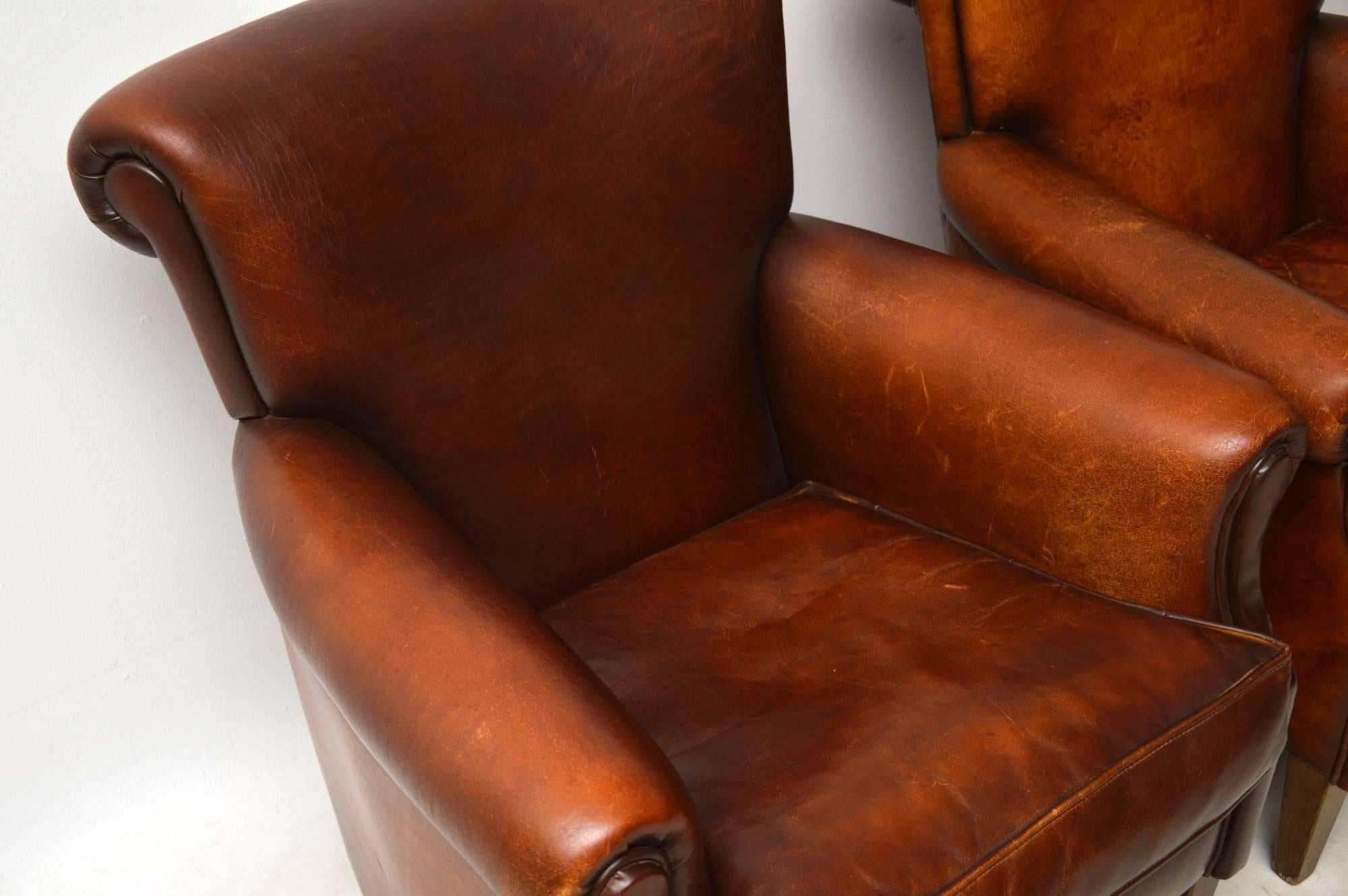 Mid-20th Century Pair of Antique Distressed Leather Armchairs