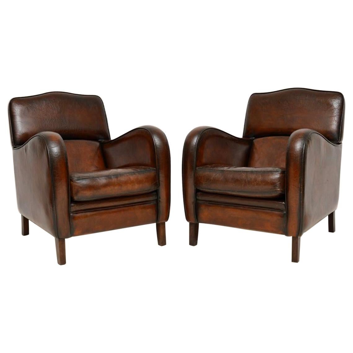 Pair of Antique Distressed Leather Armchairs