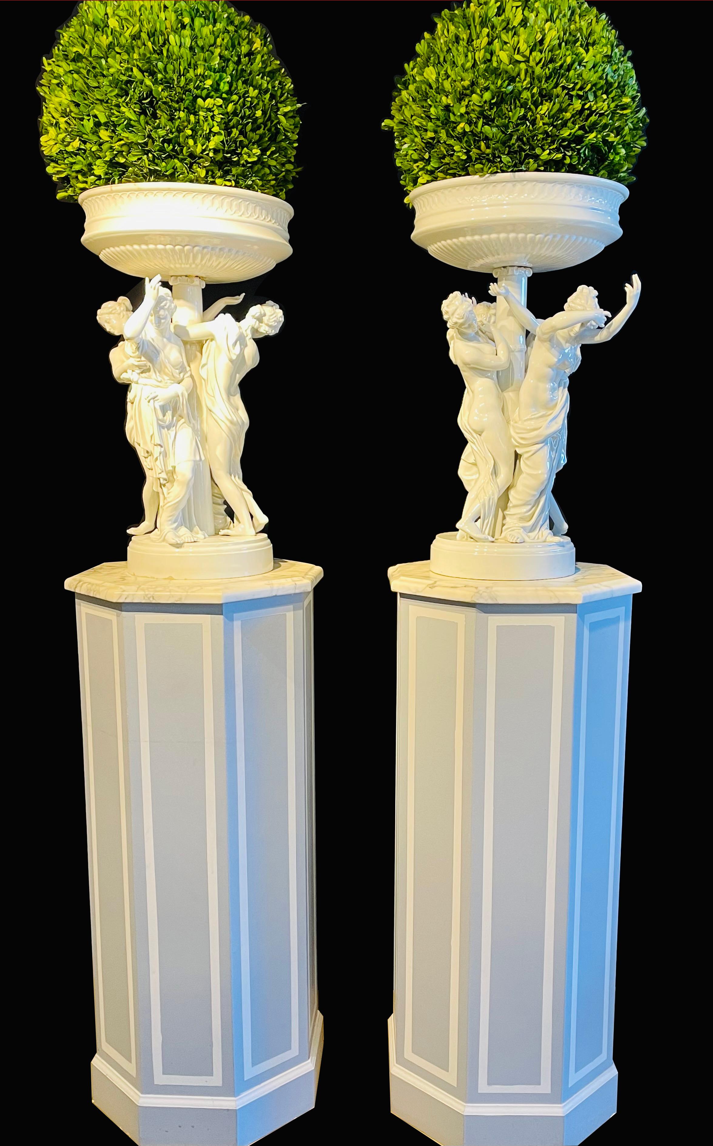 Pair of antique Dresden planters jardinières each with four dancing nymphs. A stunning pair of 20th century Dresden jardinières or planters. This one of kind pair of monumental figural Jardinières are impressive in fine condition. Each planter