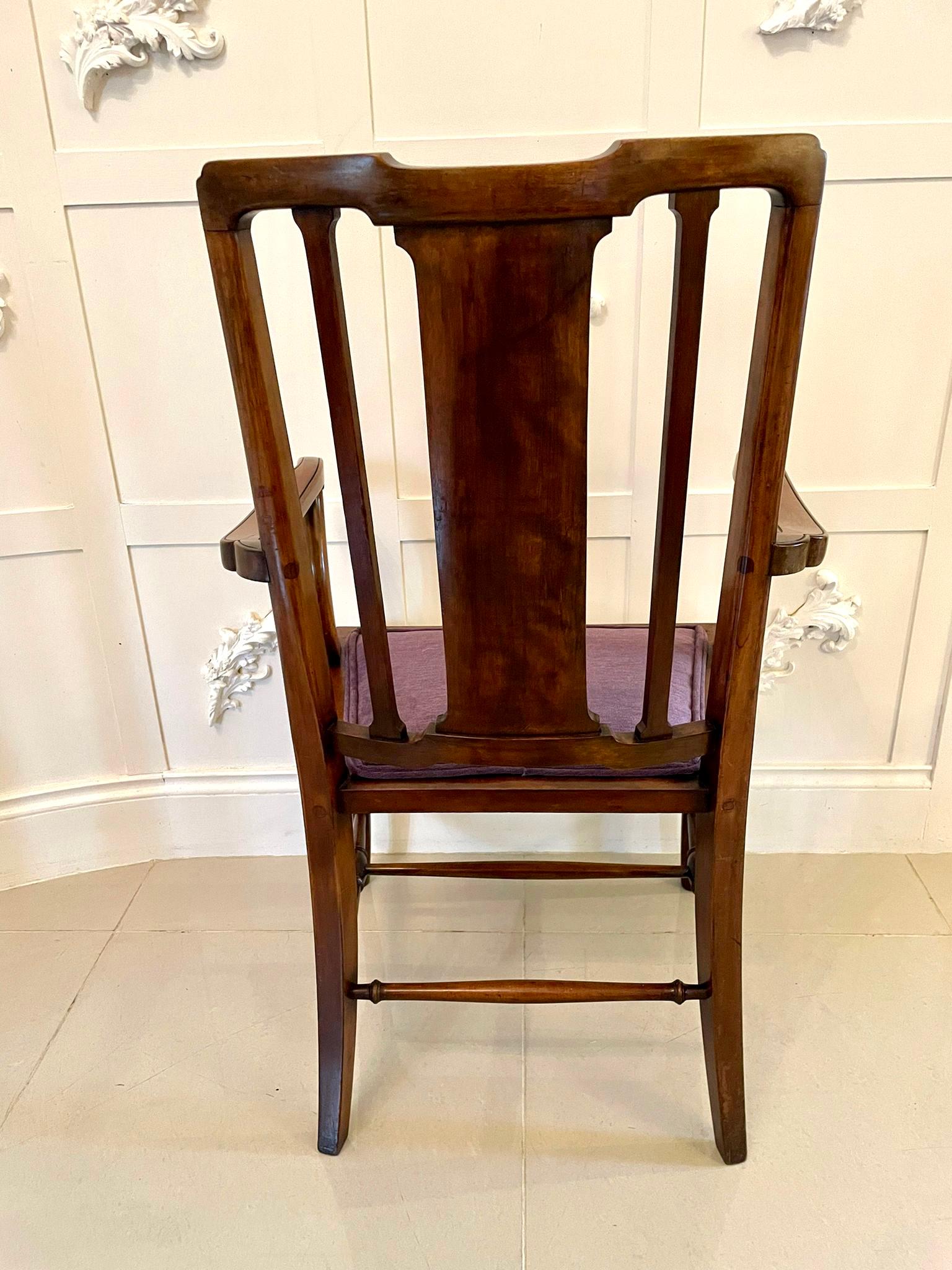 Pair of antique Edwardian inlaid mahogany desk chairs having a lovely shaped top rail boasting a fantastic quality marquetry inlaid splat to the centre, shaped open arms, newly reupholstered seats in a quality fabric standing on shaped cabriole legs