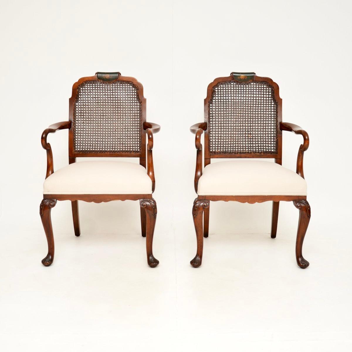 A beautiful pair of antique Edwardian lacquered walnut and cane armchairs. They were made in England, they date from around the 1900-1910 period.

The quality is superb, they have a gorgeous design in the Queen Anne style. The solid walnut frames