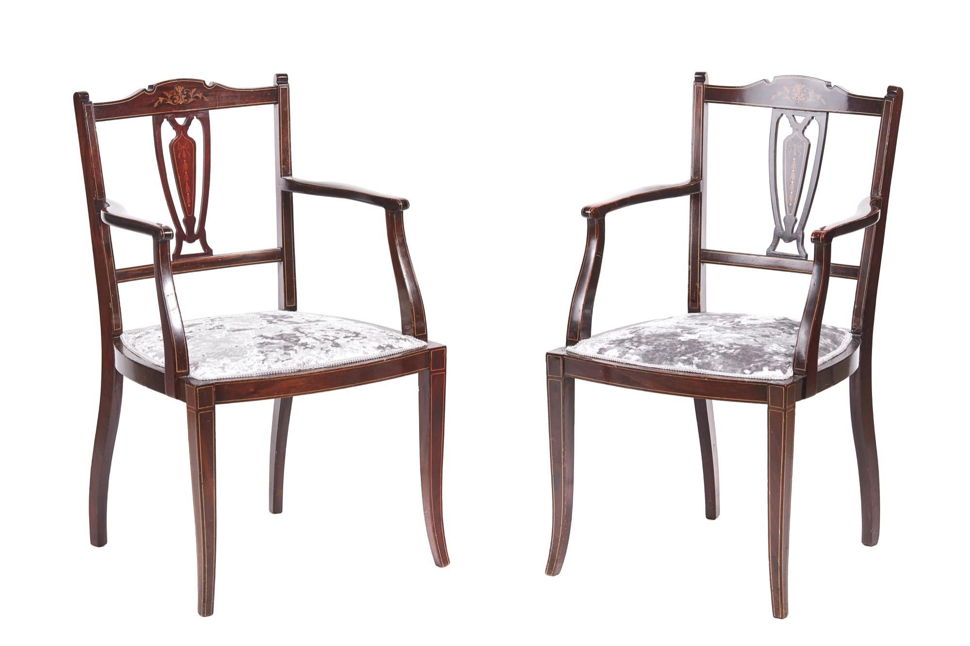 Pair of antique Edwardian mahogany inlaid armchairs with an elegant inlaid shaped top rail and centre splat. Newly recovered seats in a quality stylish fabric. They are supported by attractive shaped inlaid front legs and outswept back legs
 
In