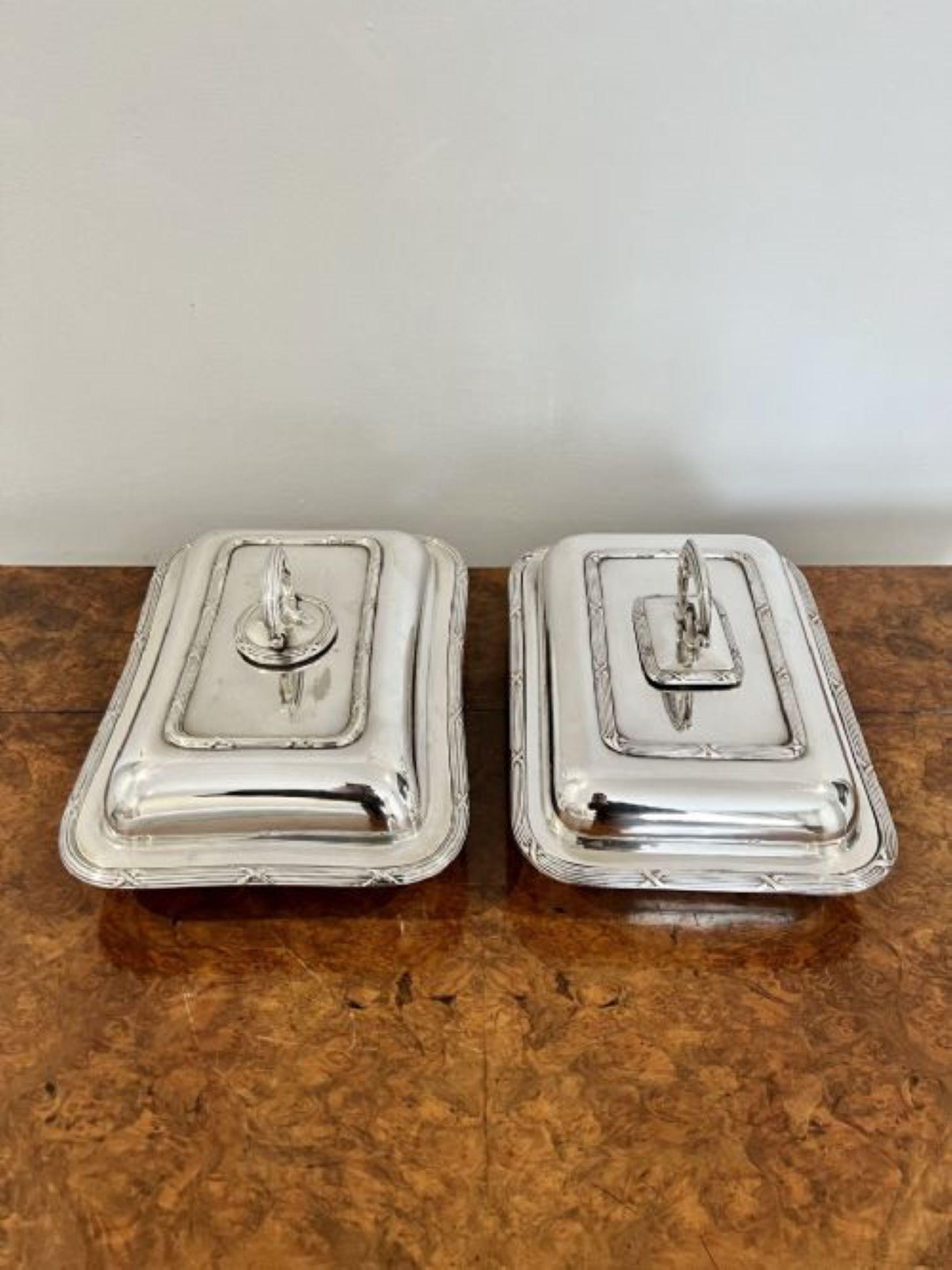 Pair of antique Edwardian silver plated entree dishes having a quality pair of silver plated rectangular entree dishes with removable lids, ornate detail and ornate handles.