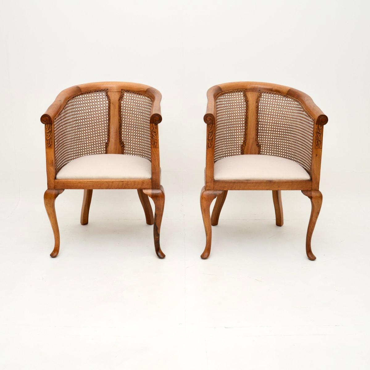 A beautiful pair of antique Edwardian walnut cane back armchairs. They were made in England and date from around 1900-1920.

They are of outstanding quality, with a beautiful, elegant and sturdy design. The beautifully caned backs have a nice curved