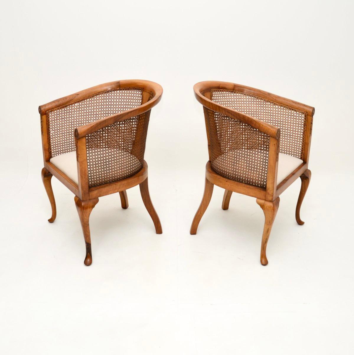 British Pair of Antique Edwardian Walnut Cane Back Armchairs For Sale
