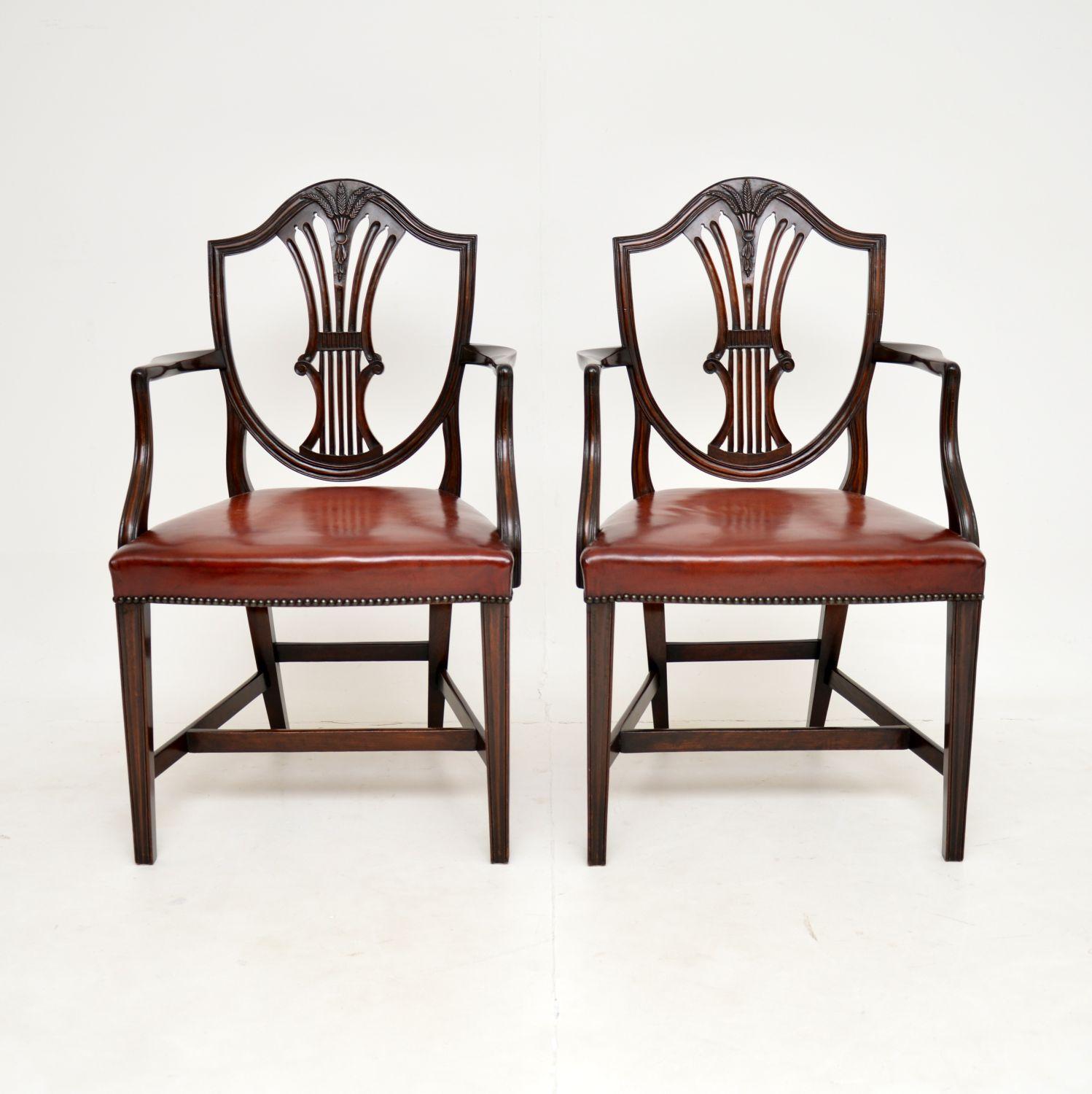 A smart and very well made pair of antique carver chairs, with leather seats. They were made in England, and date from around the 1900-1910 period.

They are beautifully made and are of very fine quality. The pierced backs have lovely intricate