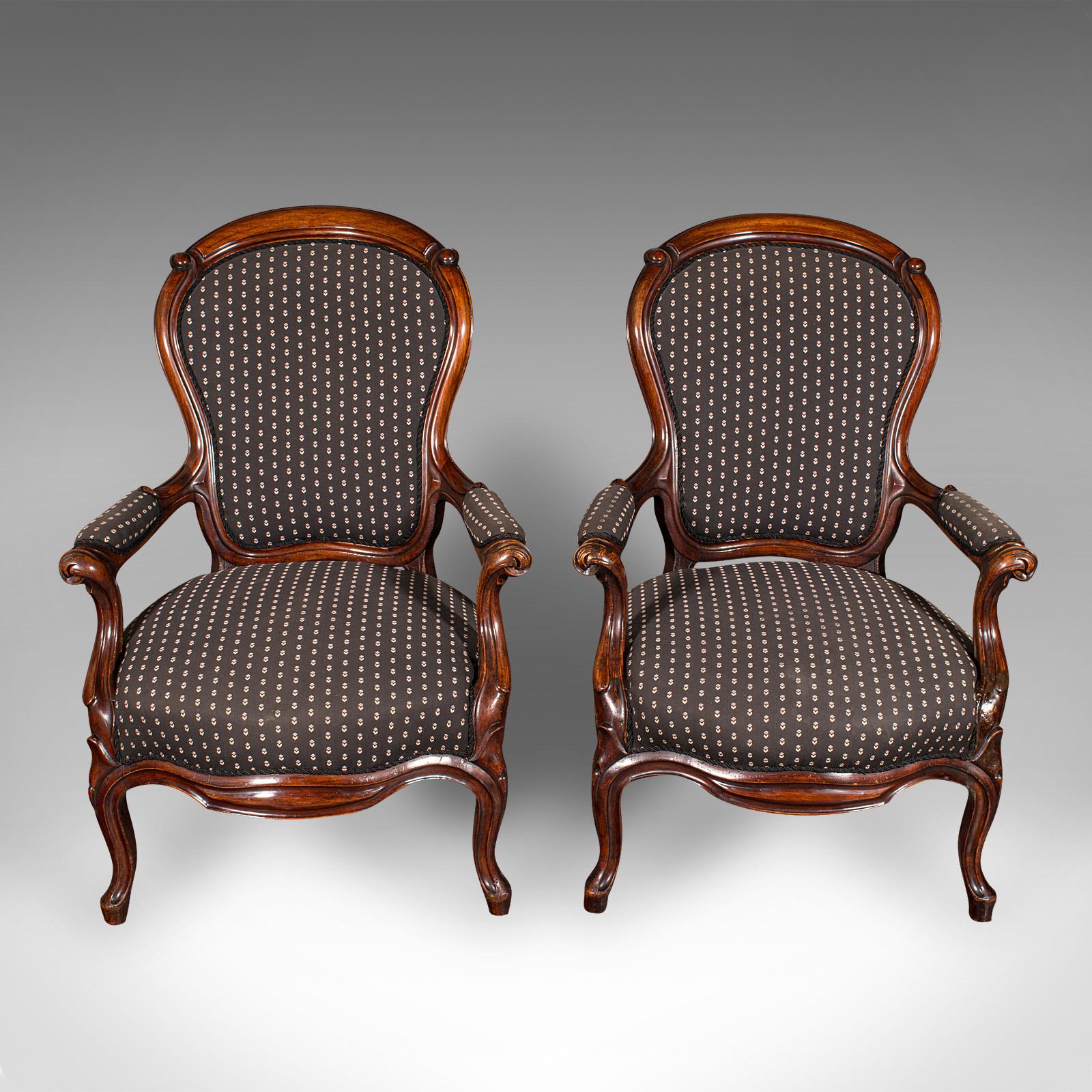 
This is a pair of antique elbow chairs. A French, mahogany upholstered morning room armchair, dating to the late Victorian period, circa 1900.

Striking chairs, with a tasteful elegance suited to any room
Displaying a desirable aged patina and in