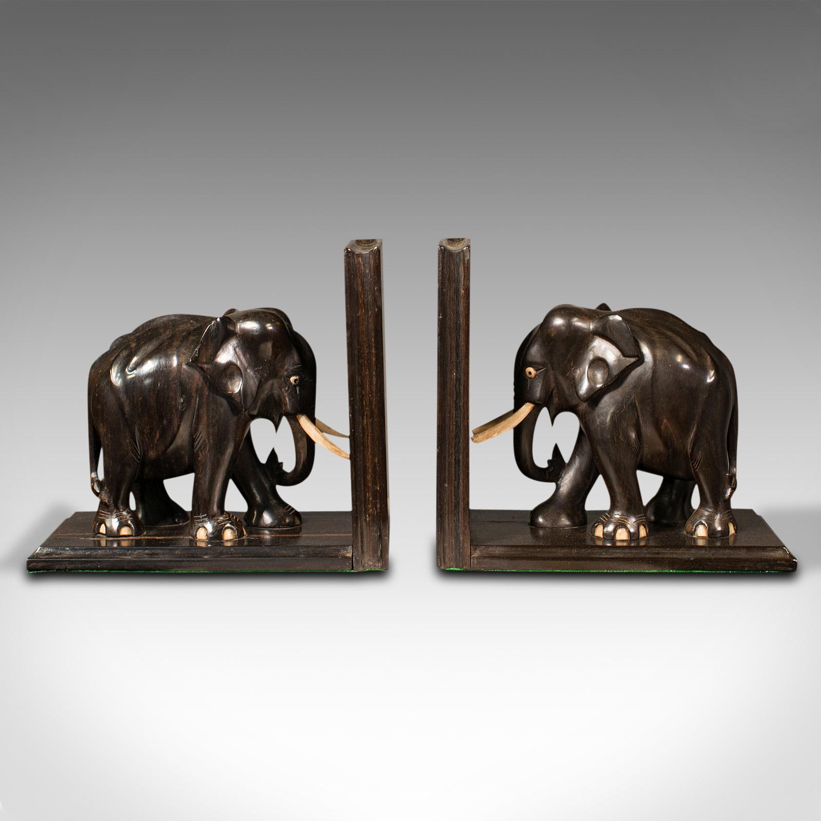 This is a pair of antique elephant bookends. An Anglo-Indian, ebony and bone decorative novel or book rest, dating to the late Victorian period, circa 1890.

Offering excellent character and display appeal for the reader
Displaying a desirable