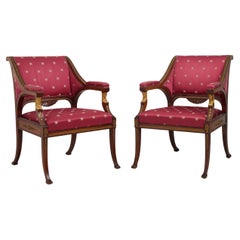 Paire de fauteuils Empire anciens en acajou, décoration en laiton et doré