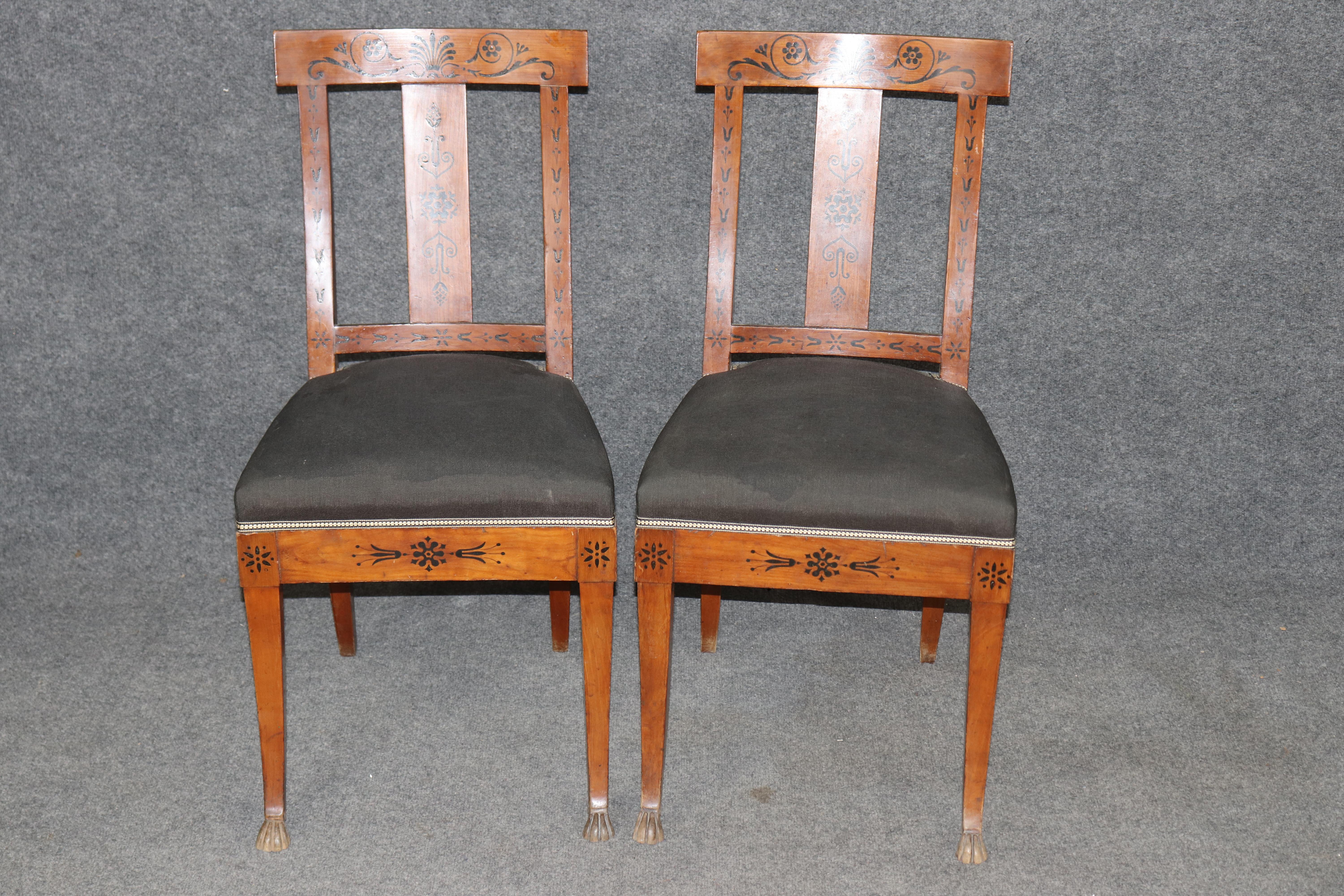 Dimensions - H: 34 1/4 in W: 17 1/4 in D: 20 1/2 in SH: 19 1/2 in 

Pair of Antique Dutch Empire Style Marquetry Inlaid & Carved Side Chairs – 19th Century Neoclassical Elegance

Elevate your interior with this exceptional pair of 19th century Dutch