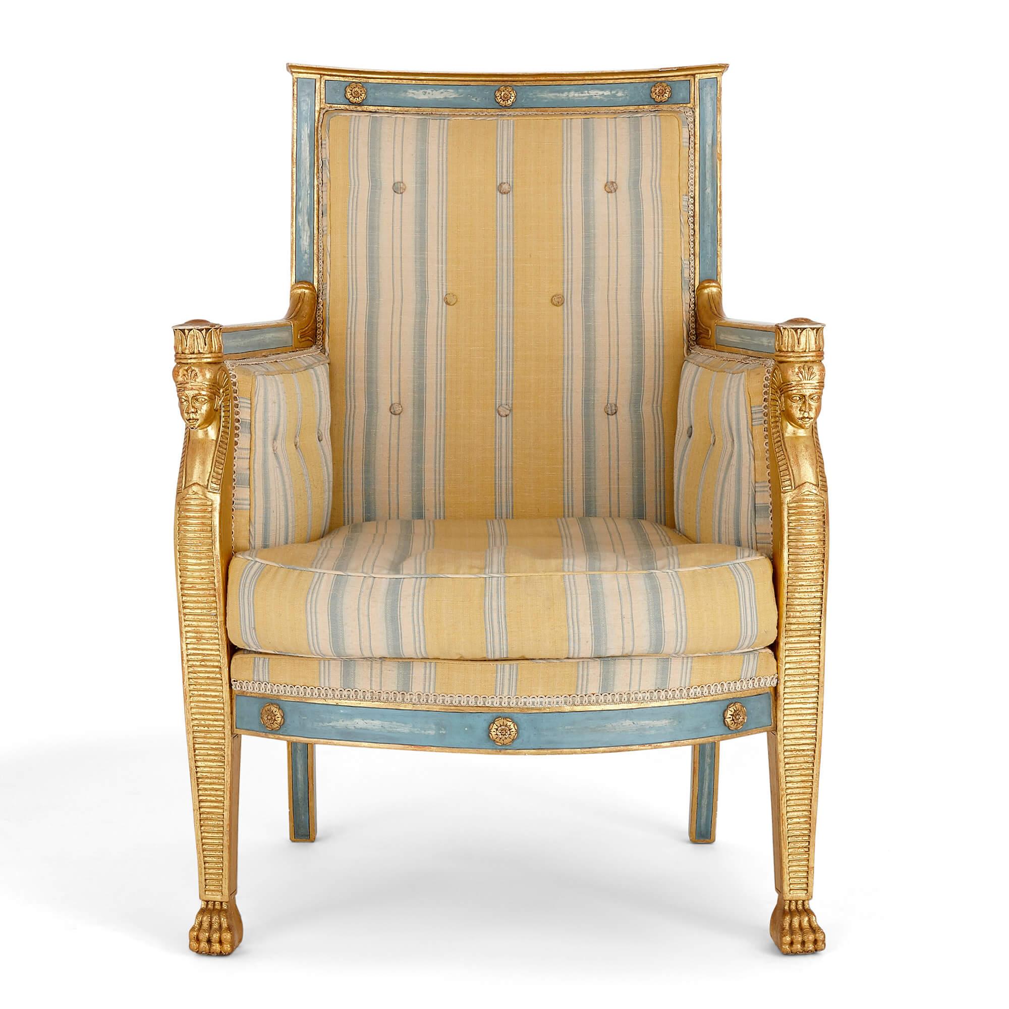 Pair of antique Empire style giltwood armchairs
French, late 19th century
Measures: Height 95cm, width 66cm, depth 56cm

The beautiful armchairs in this pair feature a striking colour palette: blue and yellow, brought out in blue and yellow