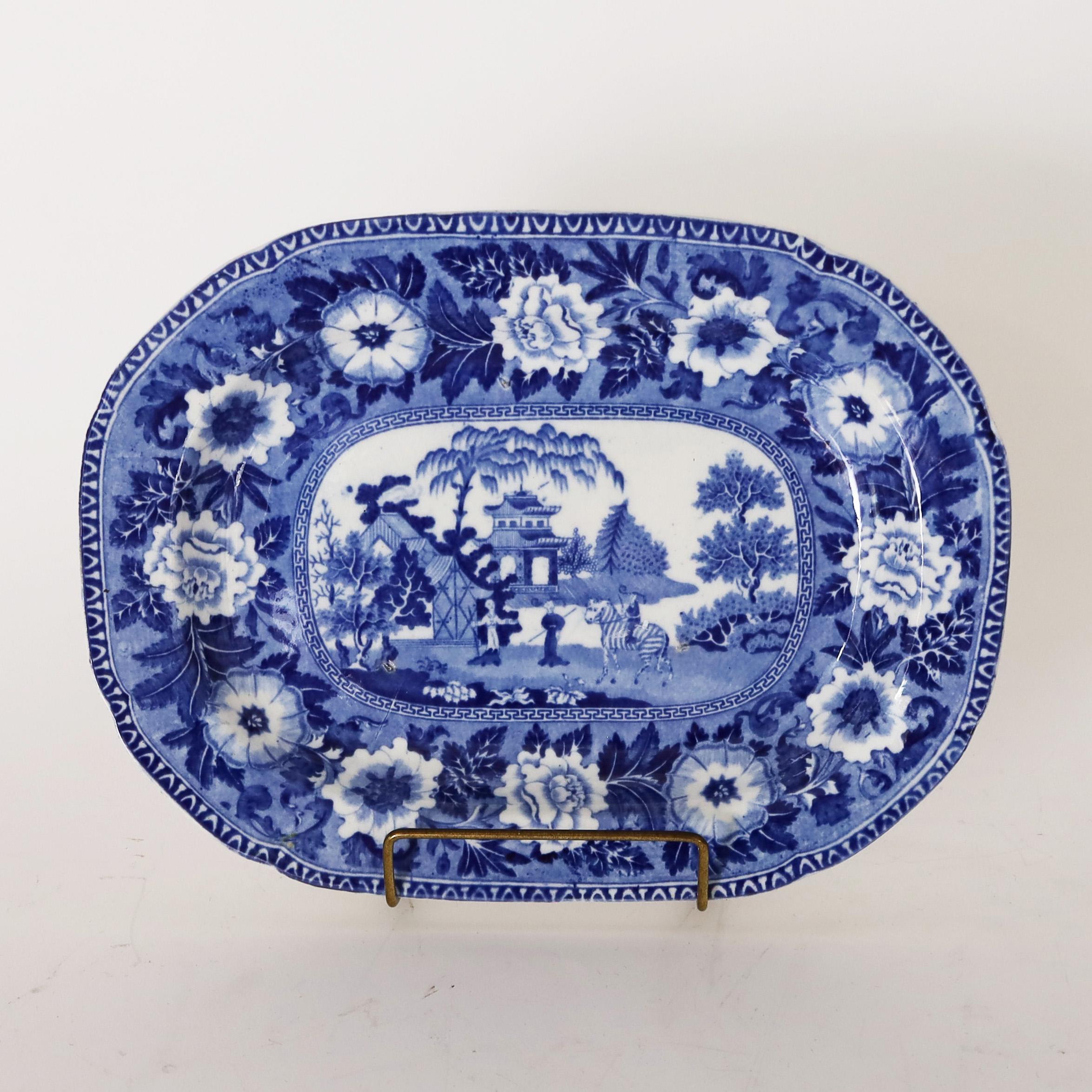 Fine pair of 19th century English orientalist blue and white transfer pottery dishes by John Rogers and Sons, Staffordshire, depicting chinoiserie landscapes in floral borders. Stamped Rogers 10 on the reverse. As seen in the last photo of the
