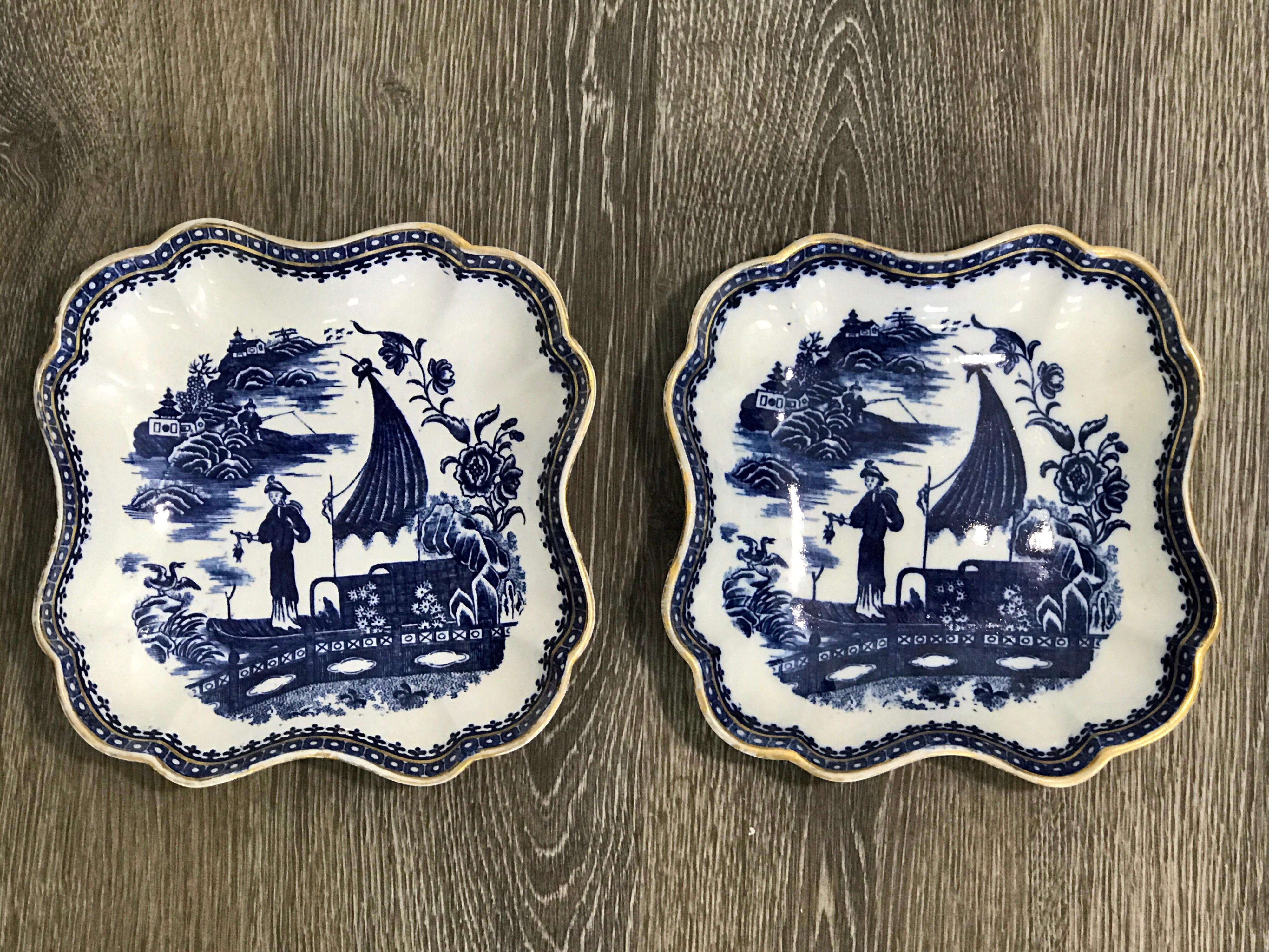 Pair of antique English blue and white chinoiserie square bowls by Caughley, each one with scalloped edges with gilt borders. Unmarked, one has a slight chip on the back rim, presents well.
 