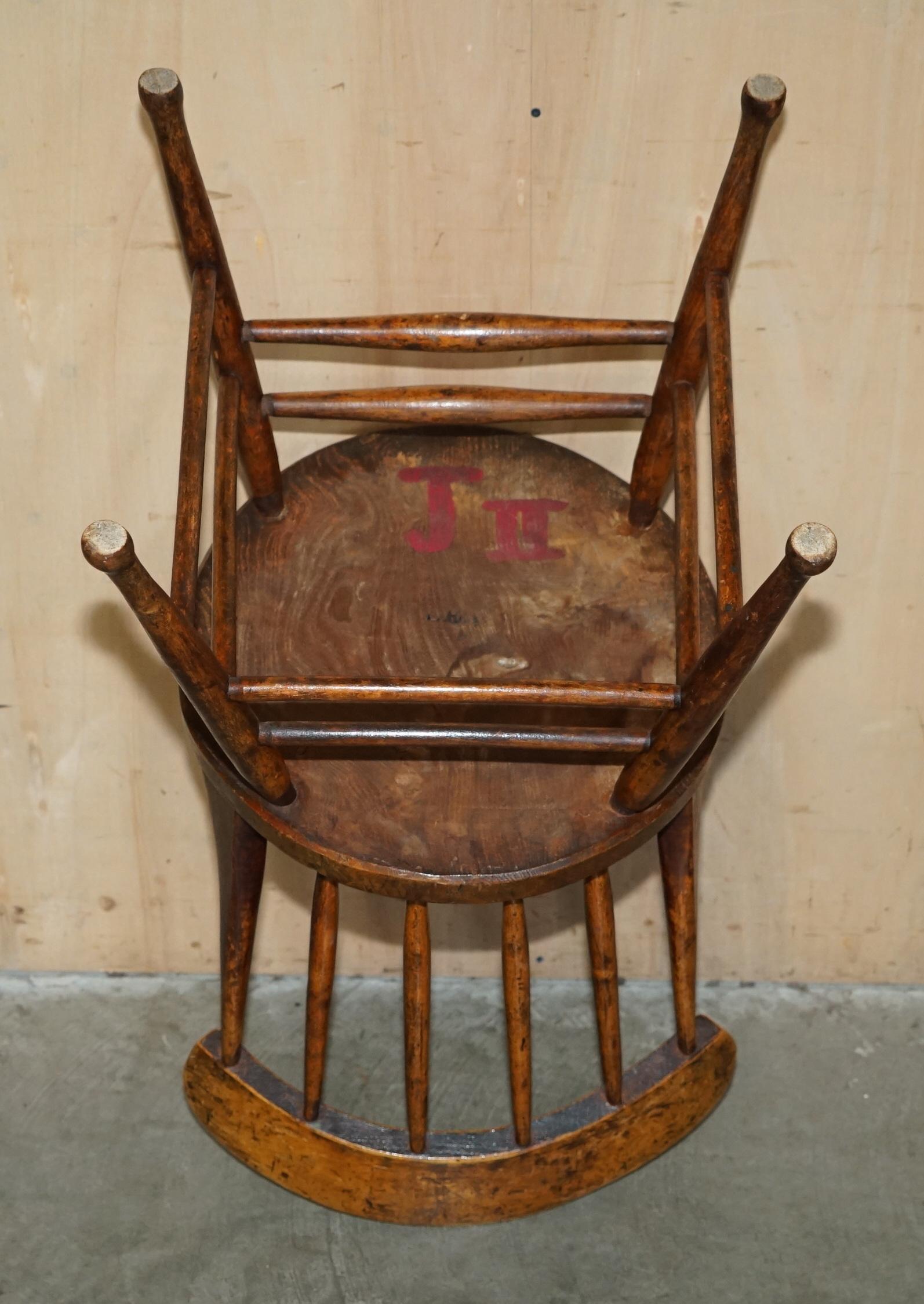 PAiR OF ANTIQUE ENGLISH ELM WINDSOR STICK BACK CHAIRS STAMPED LEA HALL INFANTRY For Sale 7