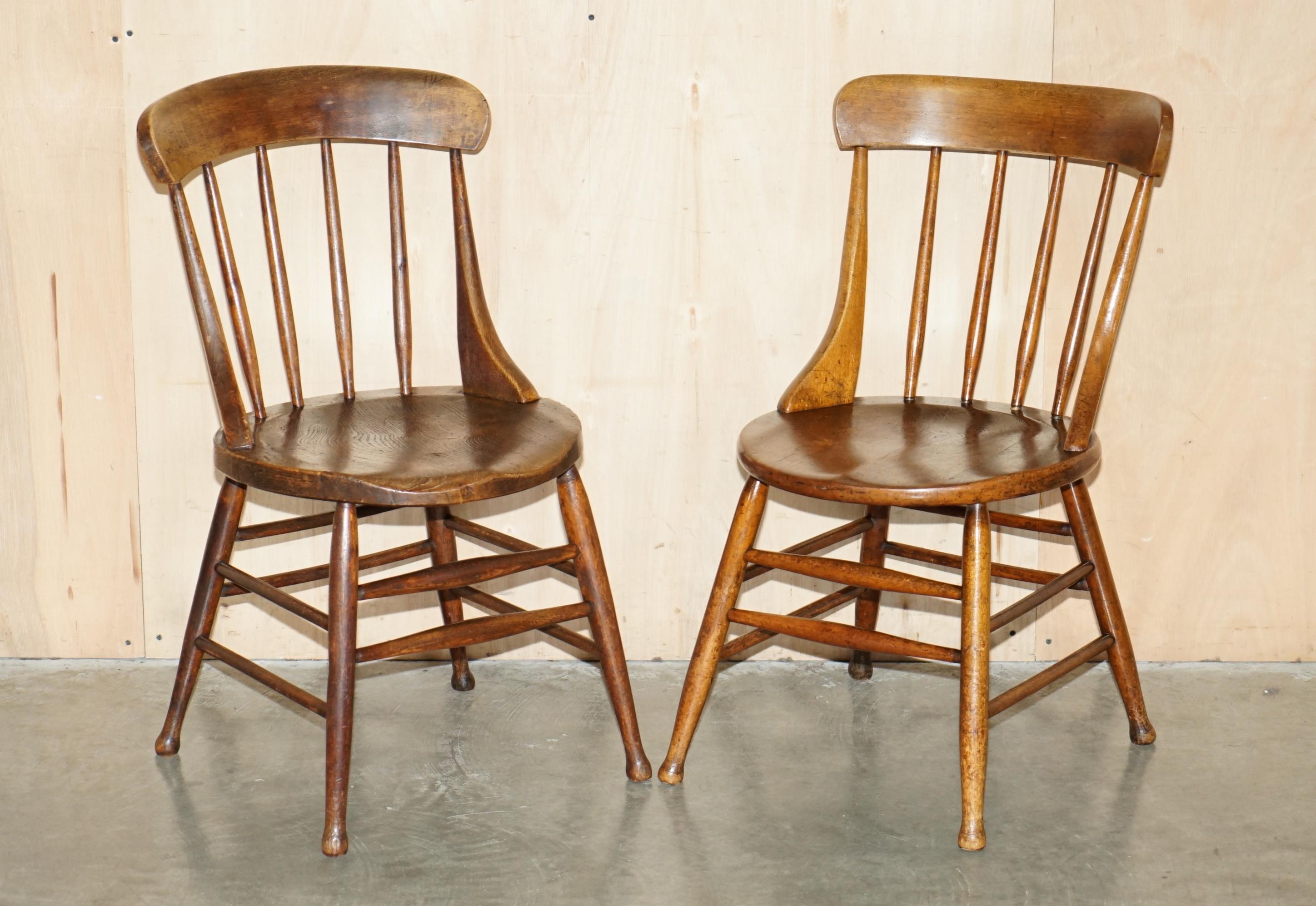 High Victorian PAiR OF ANTIQUE ENGLISH ELM WINDSOR STICK BACK CHAIRS STAMPED LEA HALL INFANTRY For Sale