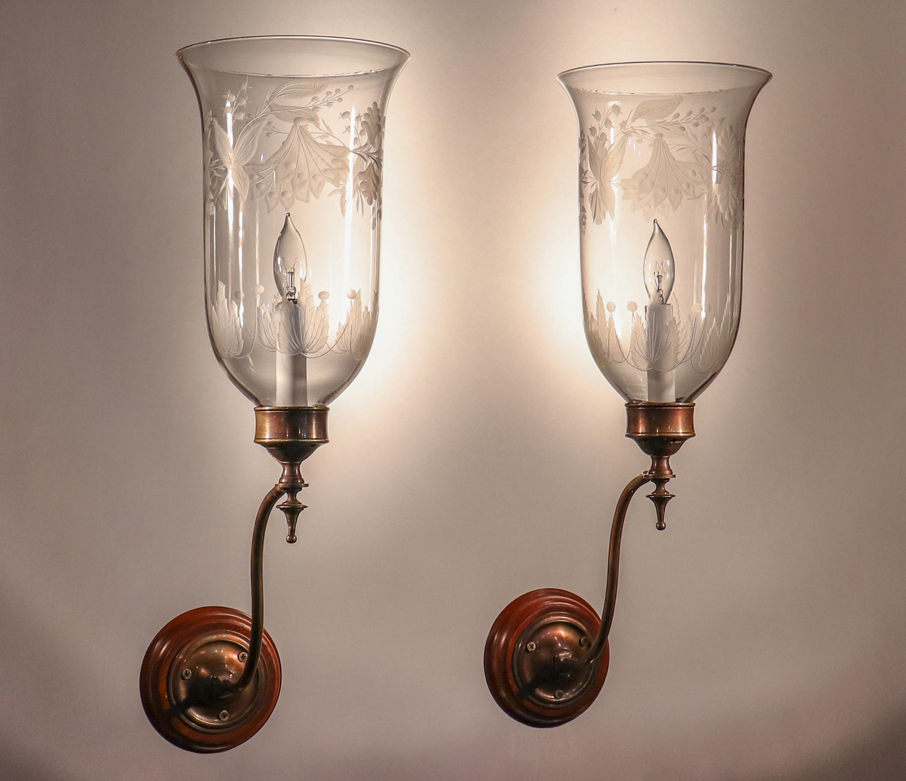 An exceptional pair of hurricane sconce shades from England (c. 1890) with full, flared form and superb quality hand blown glass. These hurricane shades feature an attractive flower and leaf frosted motif. The wall sconces have been newly