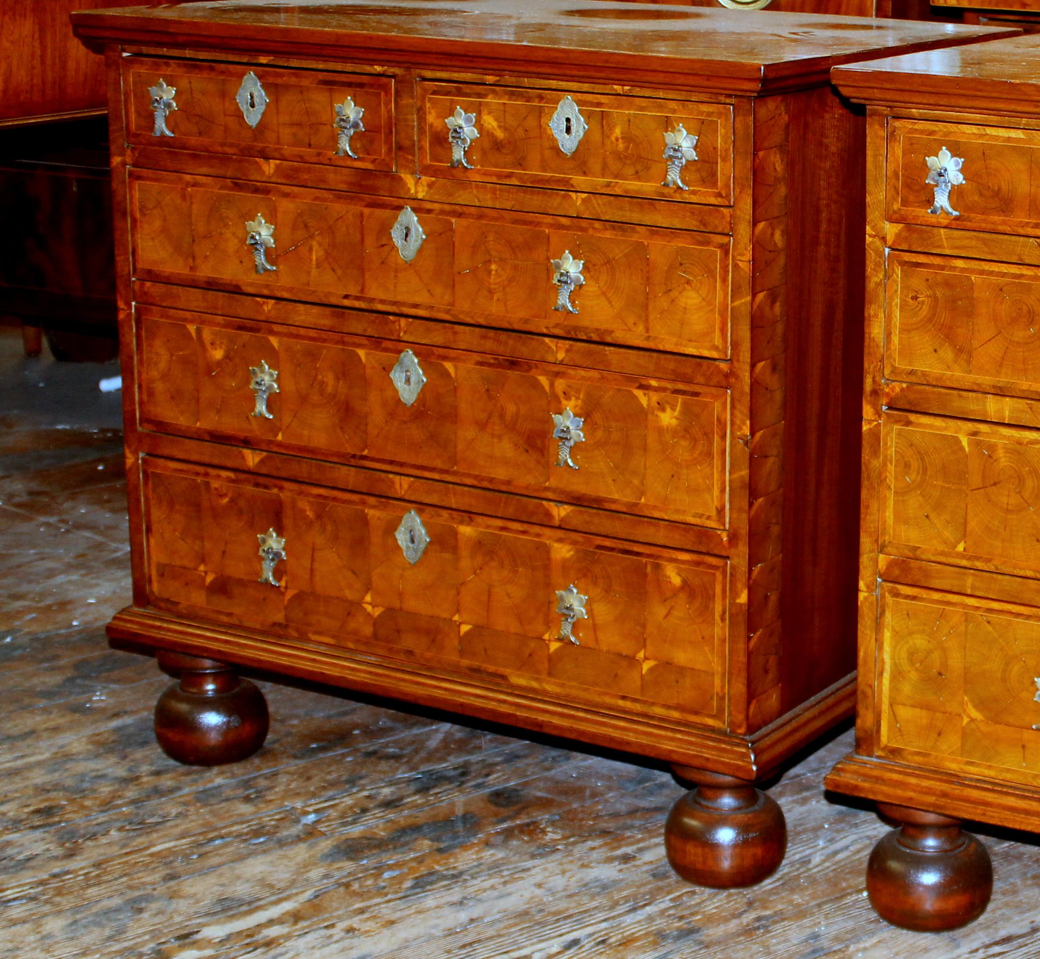 Pair of exceptional quality antique English inlaid laburnum oyster Veneer Queen Anne Revival bachelor's chests. Queen Anne Revival pieces were popular during the mid to late 19th century. Even though the originals would have been from circa
