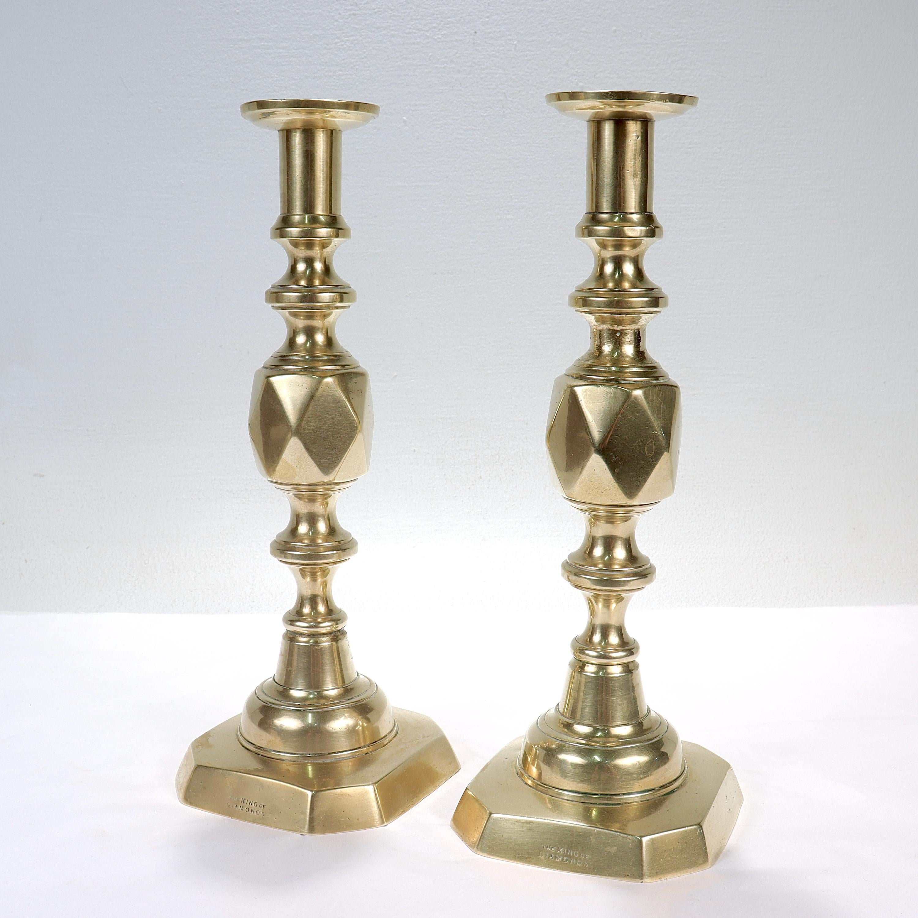 A pair of fine antique King of Diamonds English brass candlesticks.

James Clews & Sons of Birmingham designed the Diamond series of candlesticks to celebrate the Diamond Jubilee of Queen Victoria in 1897. Entitled the ‘Ace of Diamonds', ‘King of