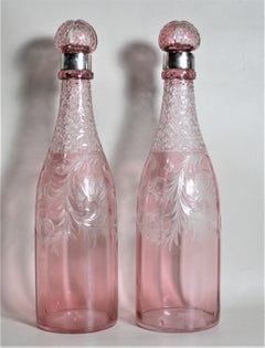 Pair of Antique Pink Cranberry Cut Glass Bottle Decanters with Sterling Rims