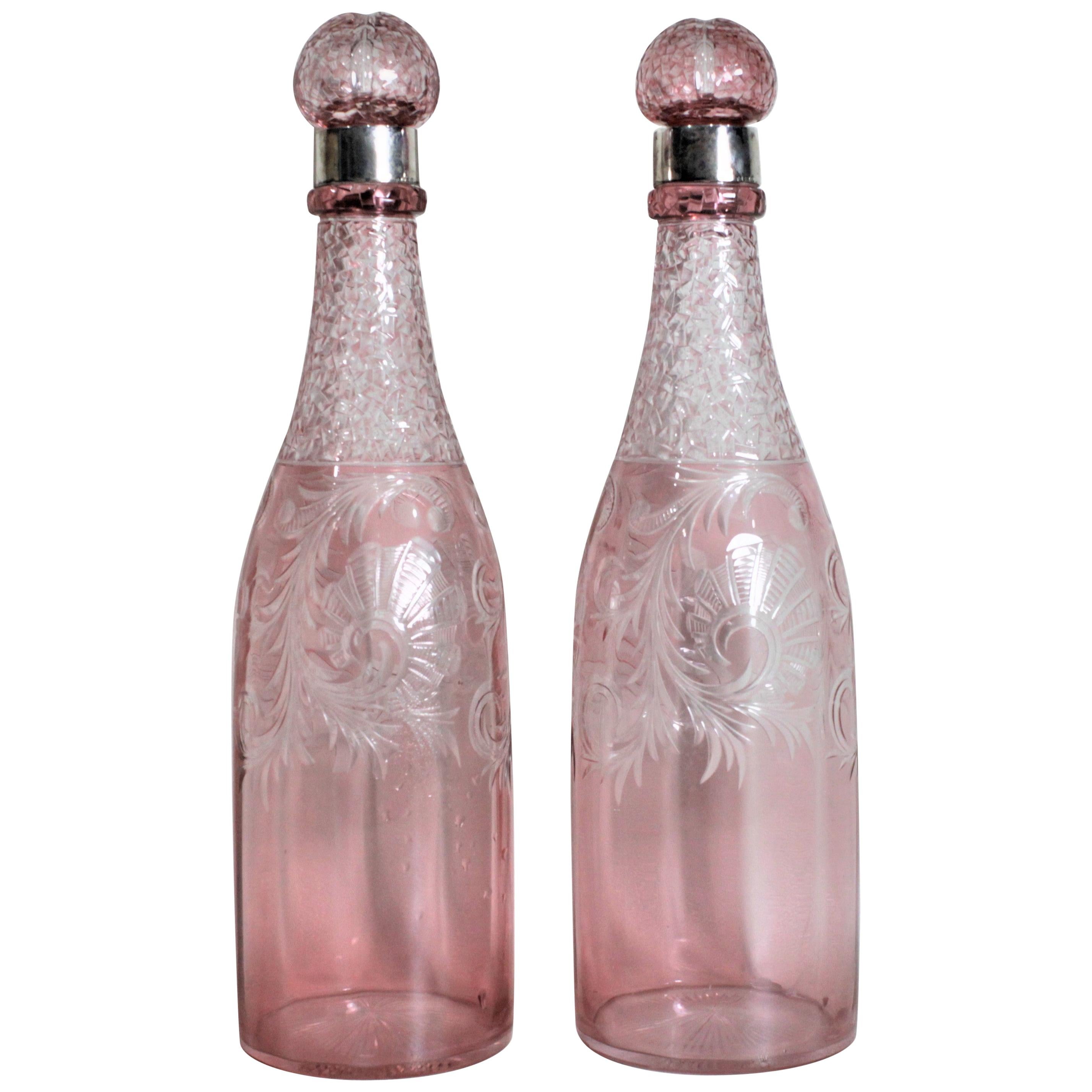 Pair of Antique Pink Cranberry Cut Glass Bottle Decanters with Sterling Rims