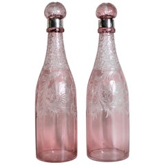 Pair of Antique Pink Cranberry Cut Glass Bottle Decanters with Sterling Rims