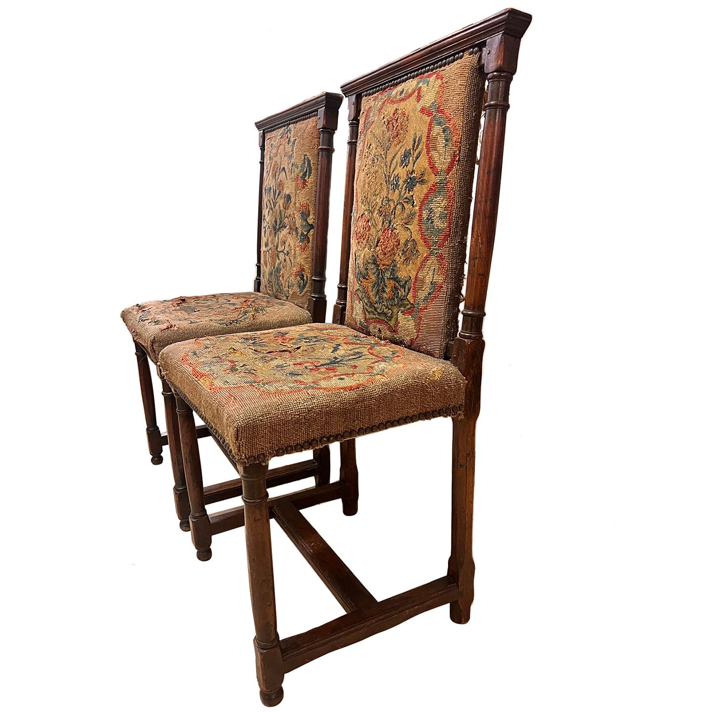 Pair of 19th Century English oak chairs with original needlepoint upholstery.

Measurements:
Height: 39