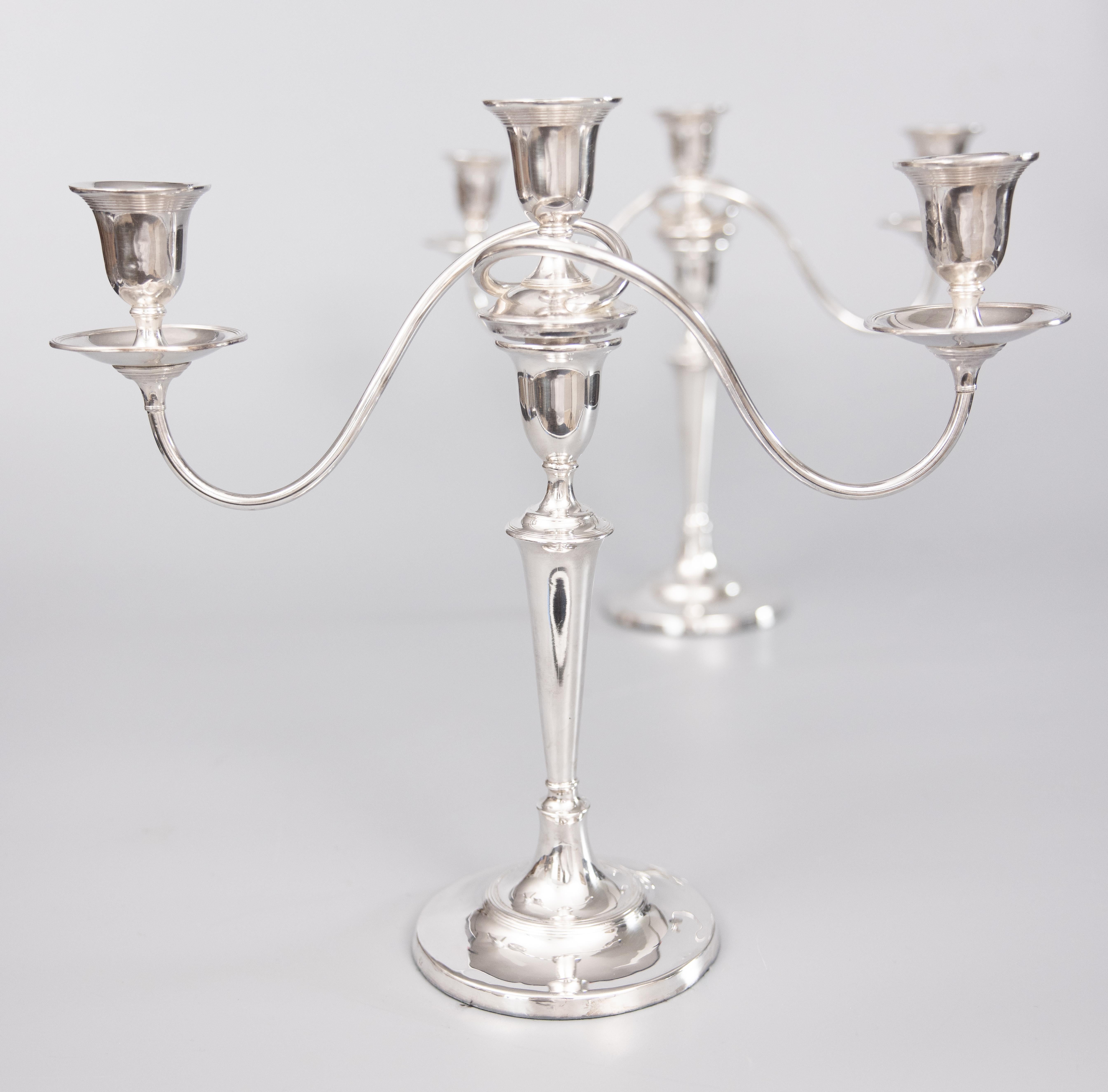 A superb pair of antique English silverplated 3 light convertible candelabras. Hallmarked on base. These fine quality candle holders are large and heavy with a beautiful design, perfect for the modern home. They would make a gorgeous centerpiece for