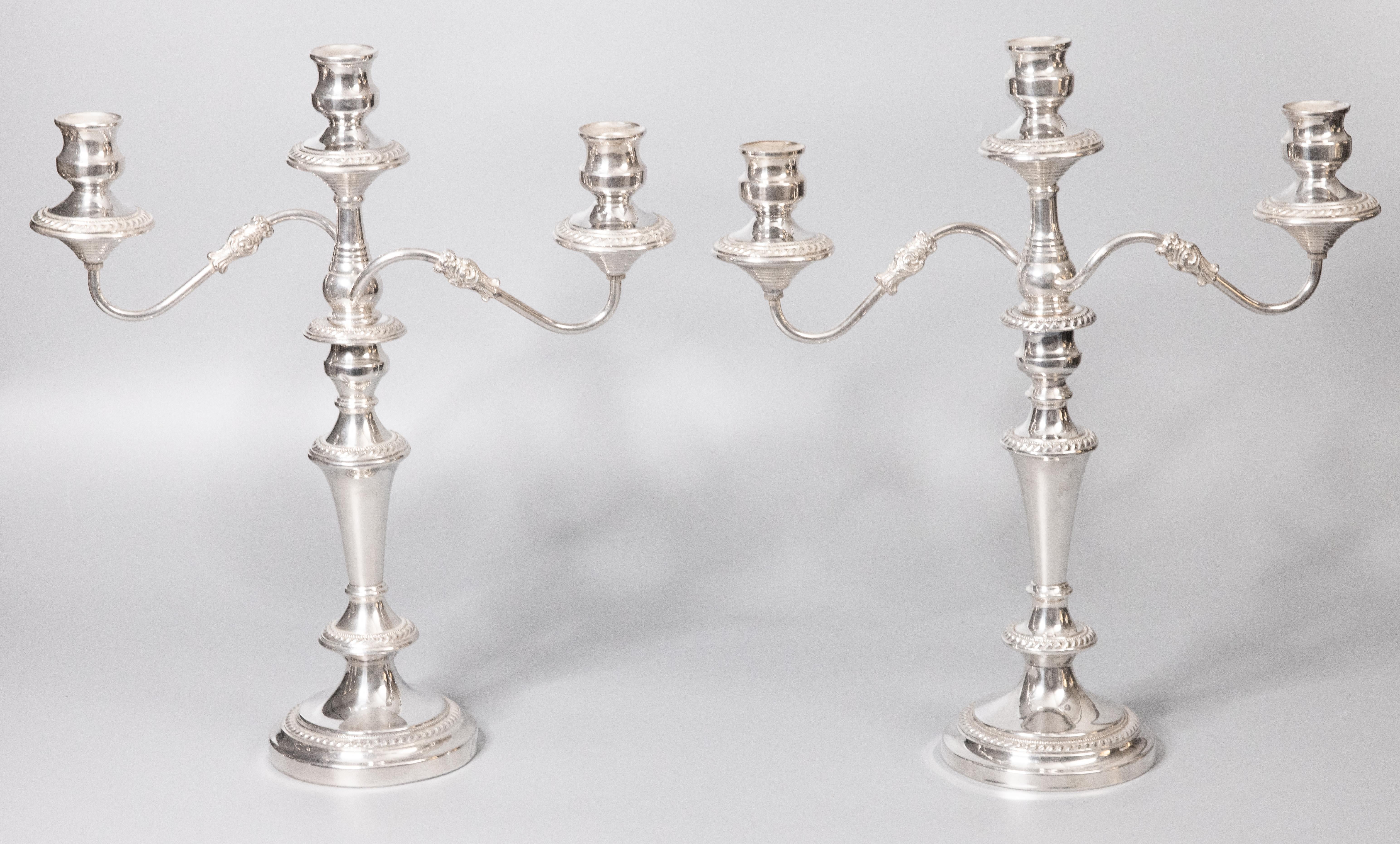 A superb pair of antique silverplate 3 light convertible candelabras. Hallmarks on reverse. These fine quality candle holders are large and heavy weighing over 9 lbs together with beautiful details. They would make a gorgeous centerpiece for a