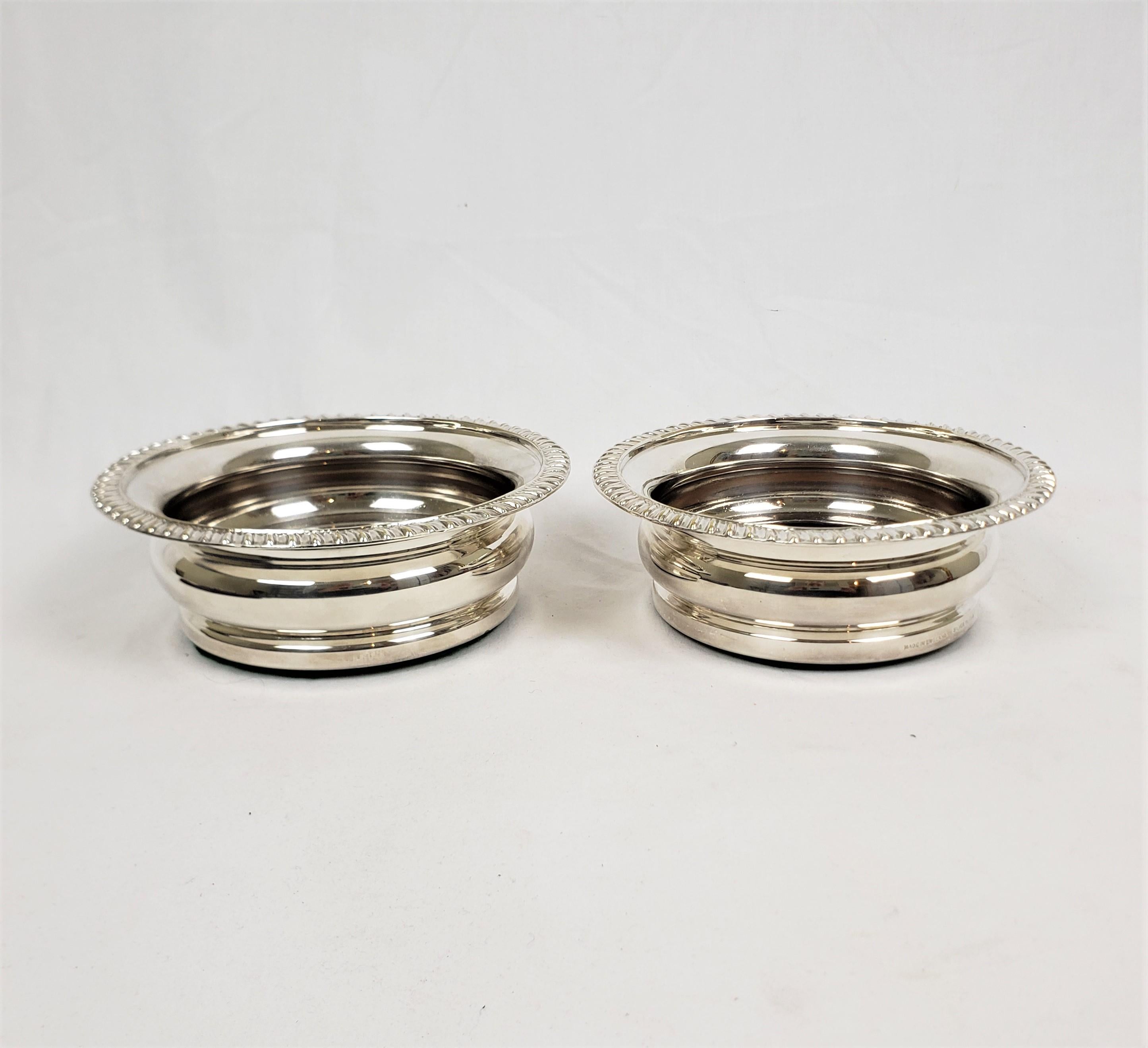 Art Deco Pair of Antique English Silver Plated Bottle Coasters with Turned Wooden Inserts For Sale