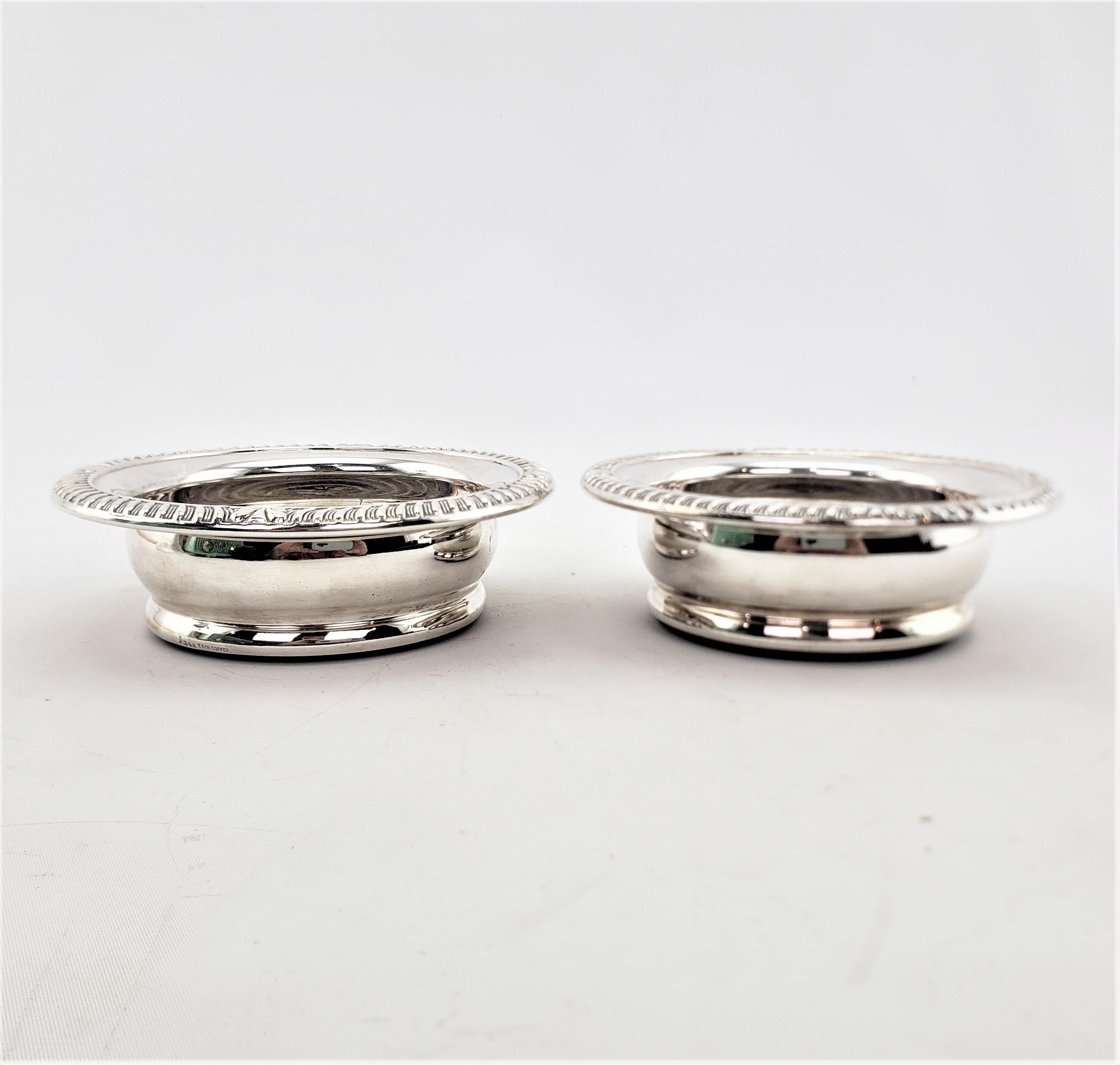 Art Deco Pair of Antique English Silver Plated Bottle Coasters with Turned Wooden Inserts For Sale