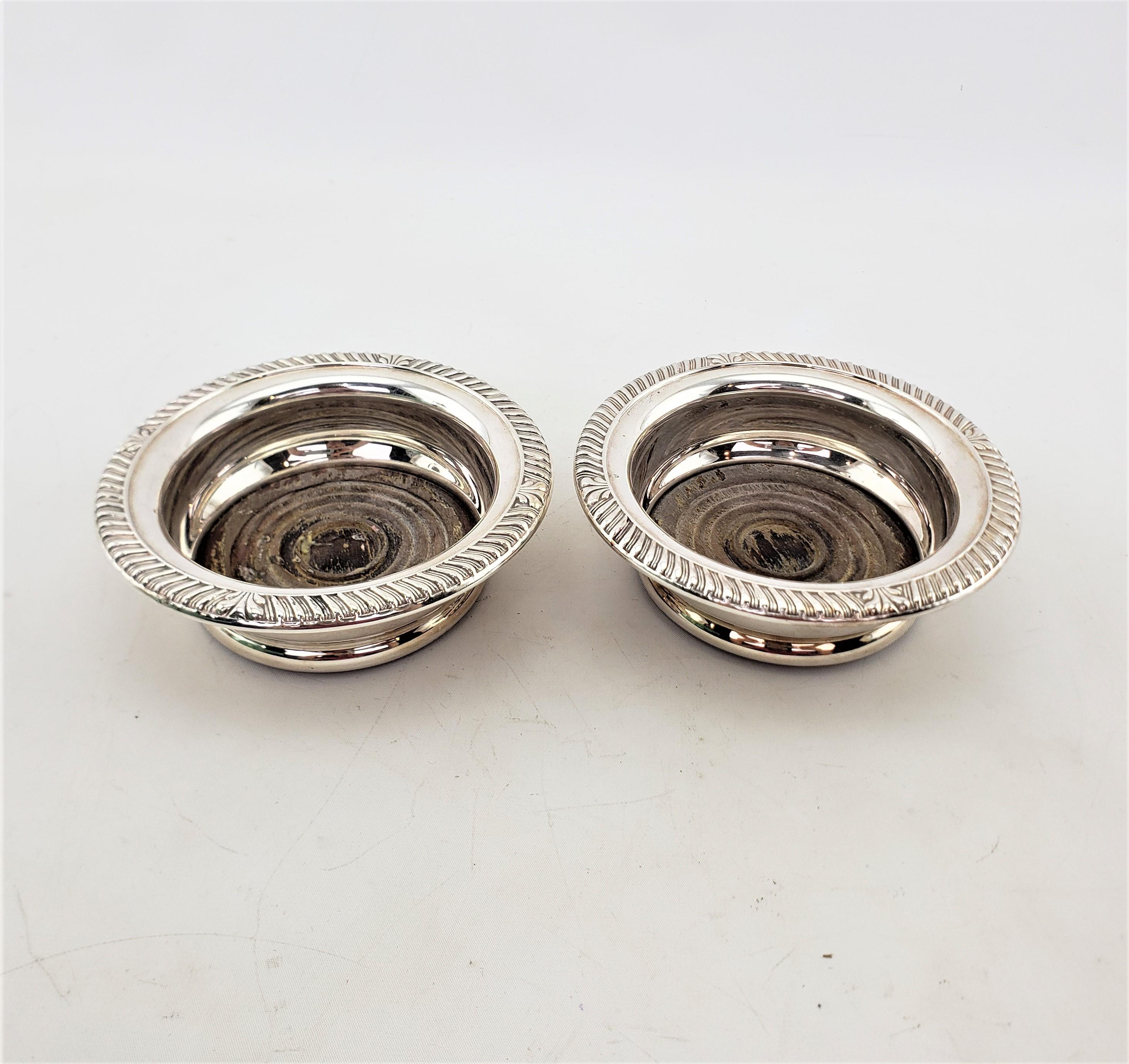 Machine-Made Pair of Antique English Silver Plated Bottle Coasters with Turned Wooden Inserts For Sale