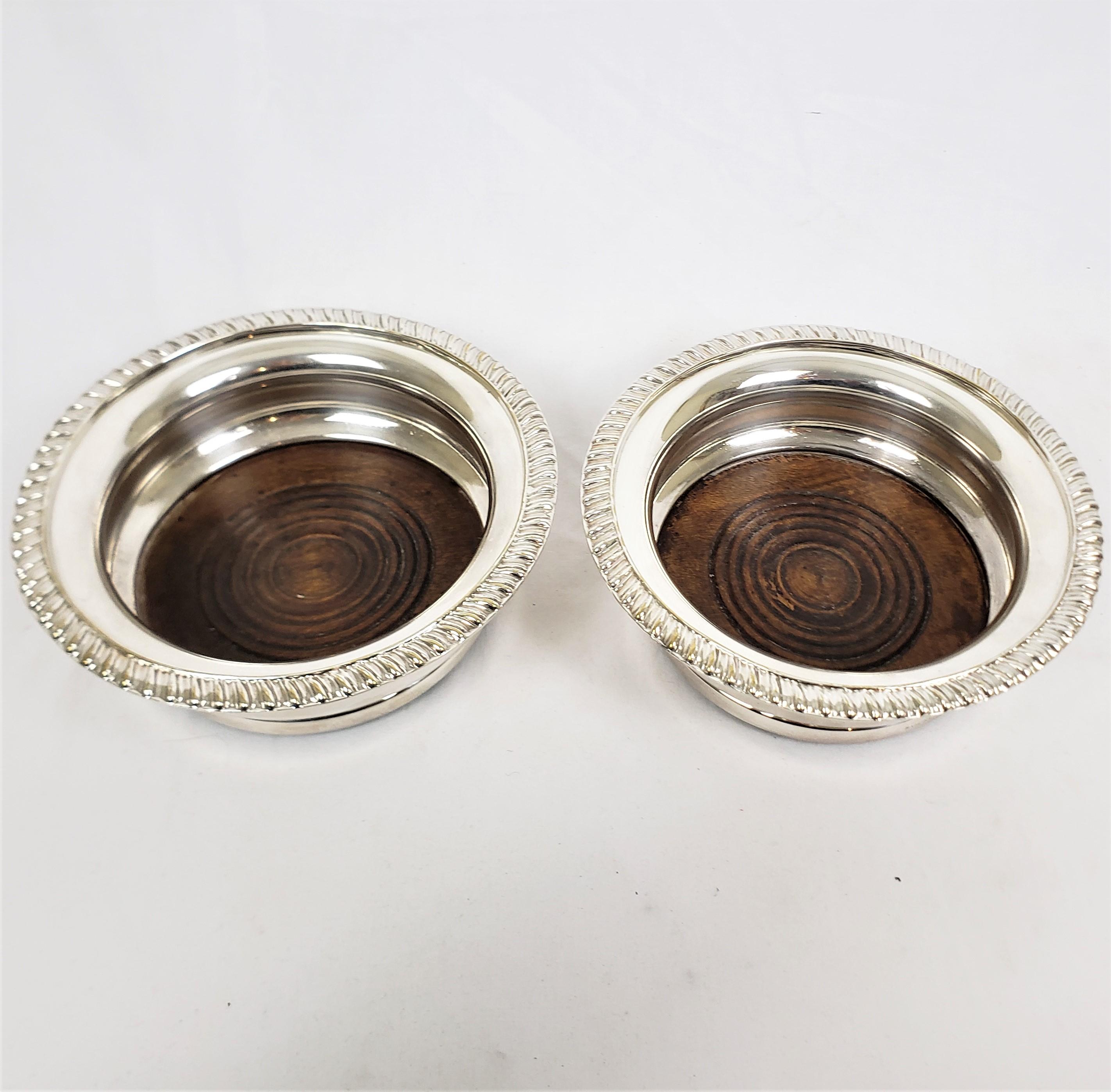 Pair of Antique English Silver Plated Bottle Coasters with Turned Wooden Inserts In Good Condition For Sale In Hamilton, Ontario