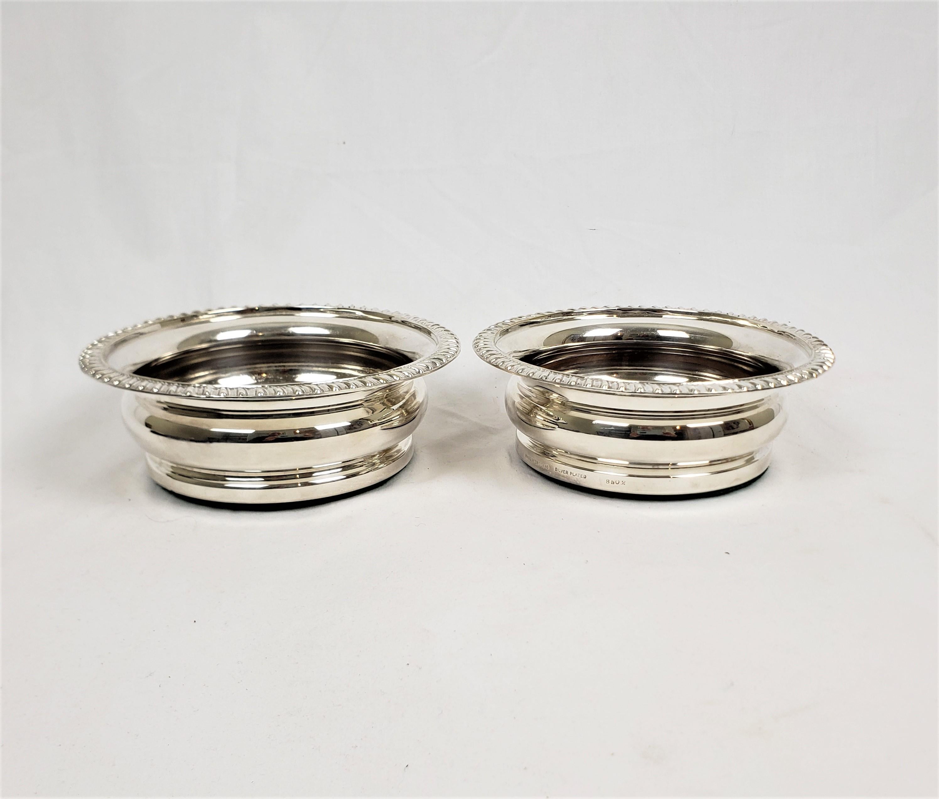 20th Century Pair of Antique English Silver Plated Bottle Coasters with Turned Wooden Inserts For Sale