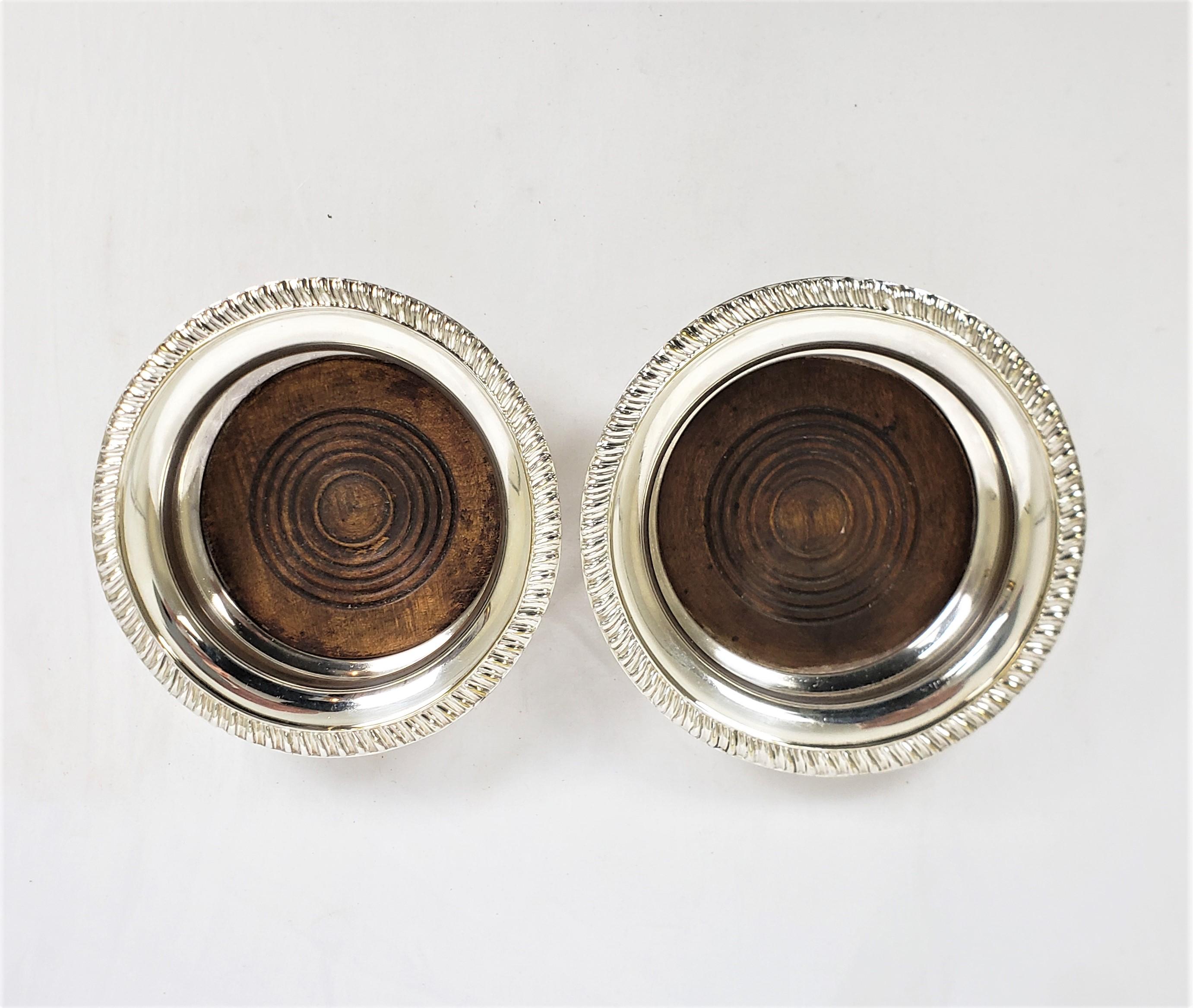 Pair of Antique English Silver Plated Bottle Coasters with Turned Wooden Inserts For Sale 1